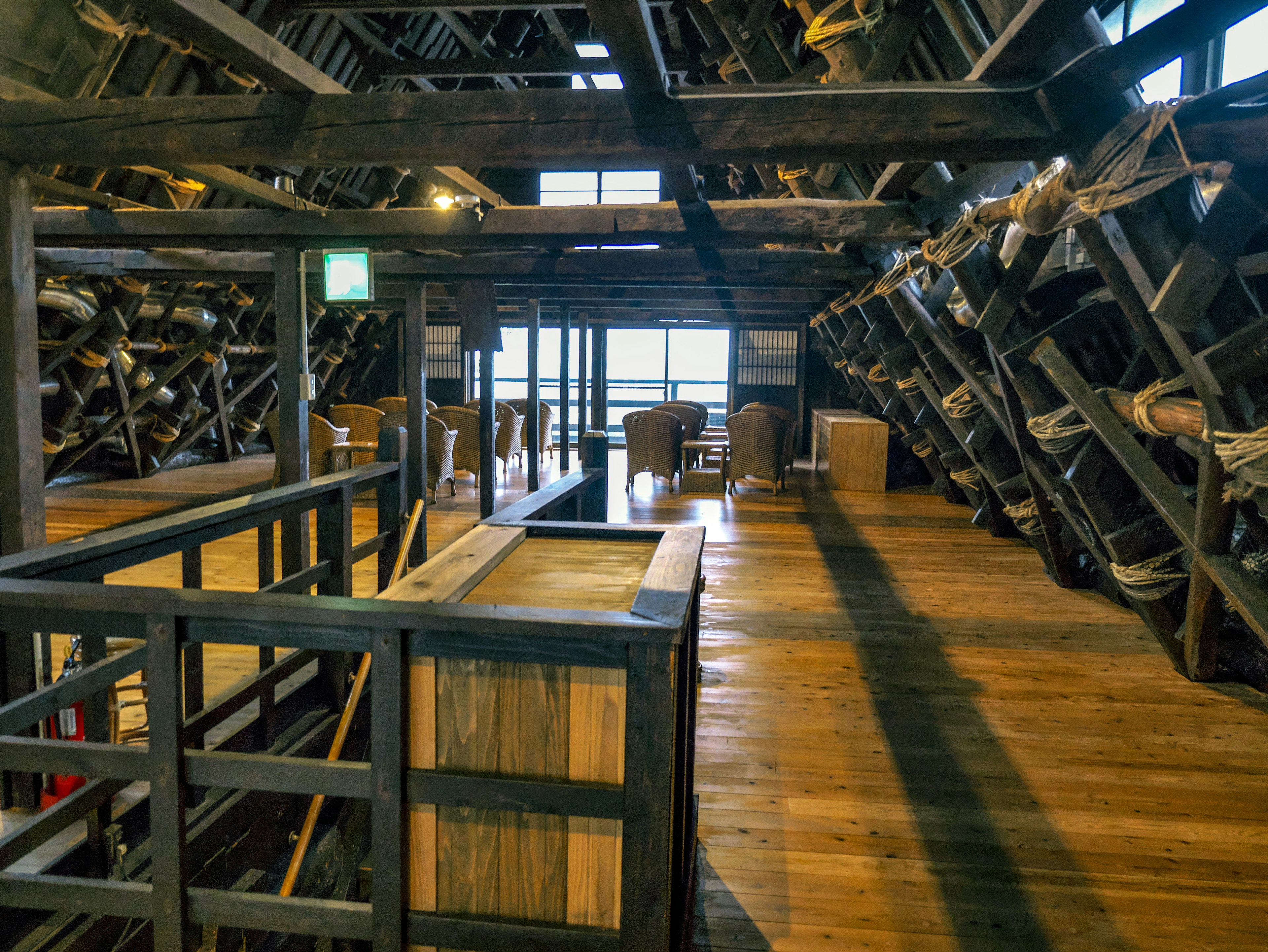 Interior view of a wooden storage warehouse with stacked items