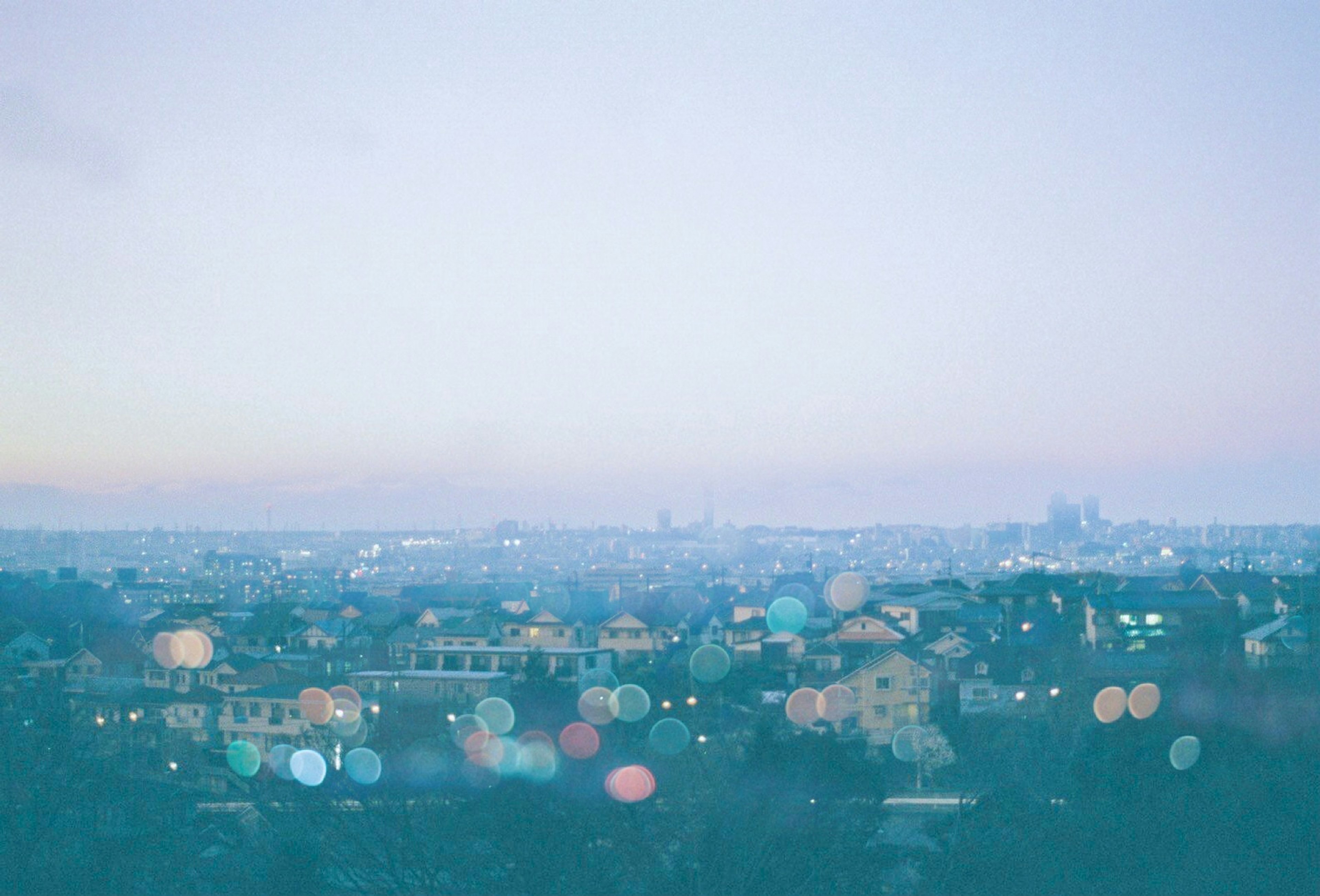 Blurry cityscape at dawn with soft colors