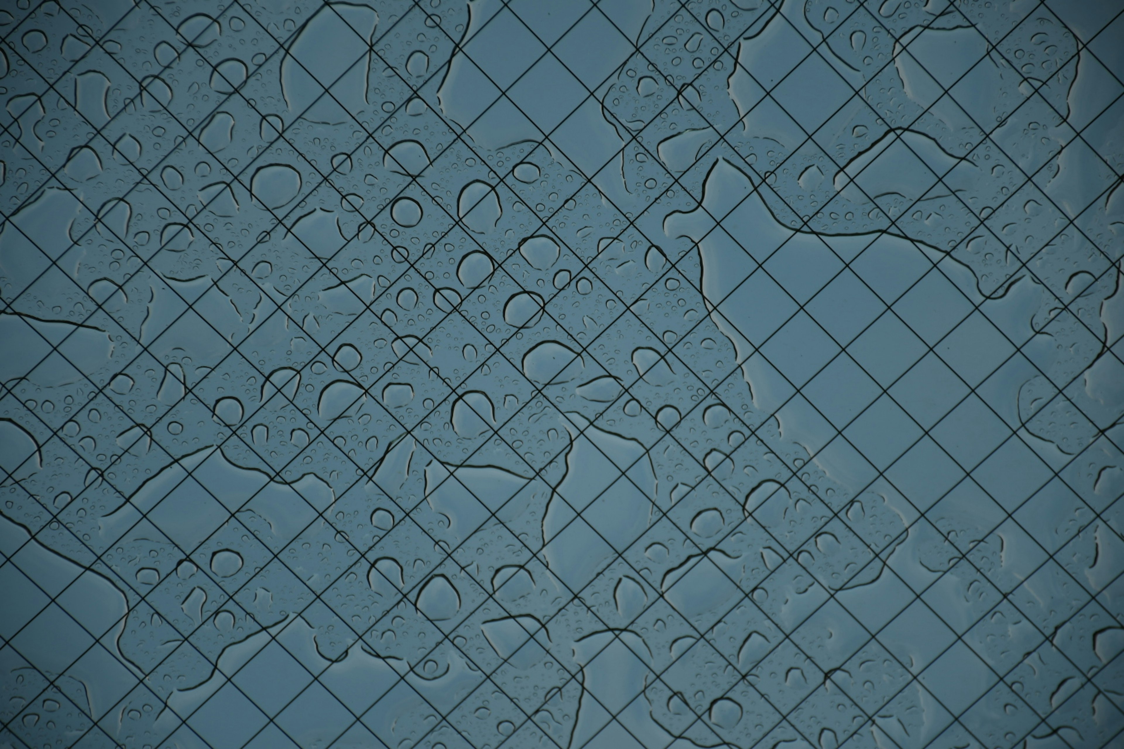 Textured background with a blue grid pattern and abstract shapes