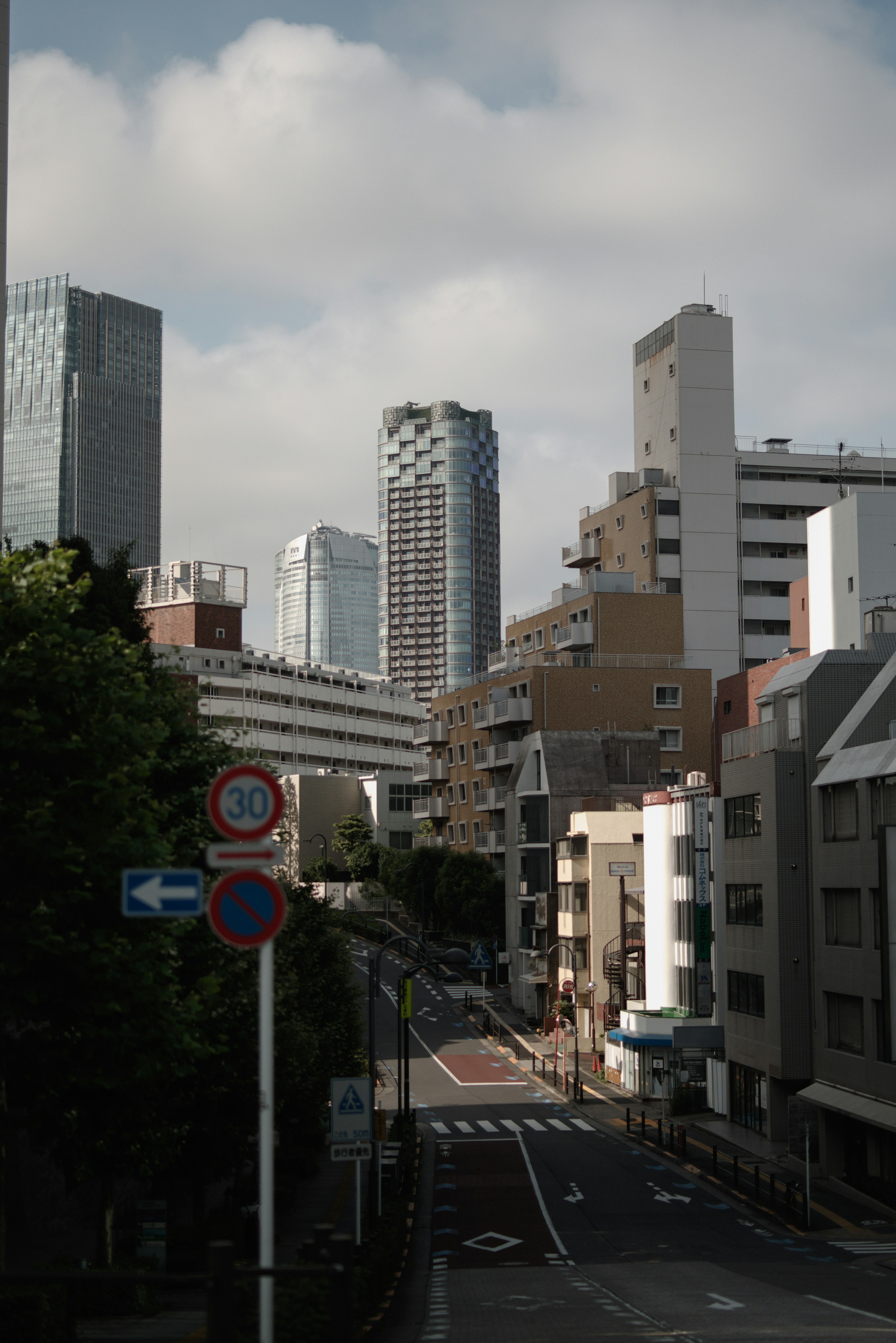 Urban landscape with tall buildings and a cloudy sky