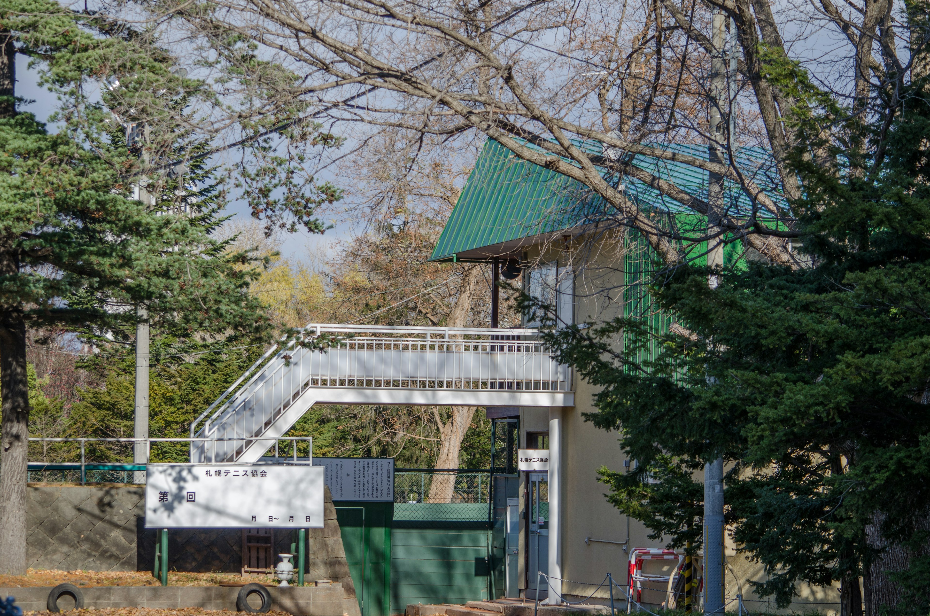 Building with green roof and staircase in a natural setting