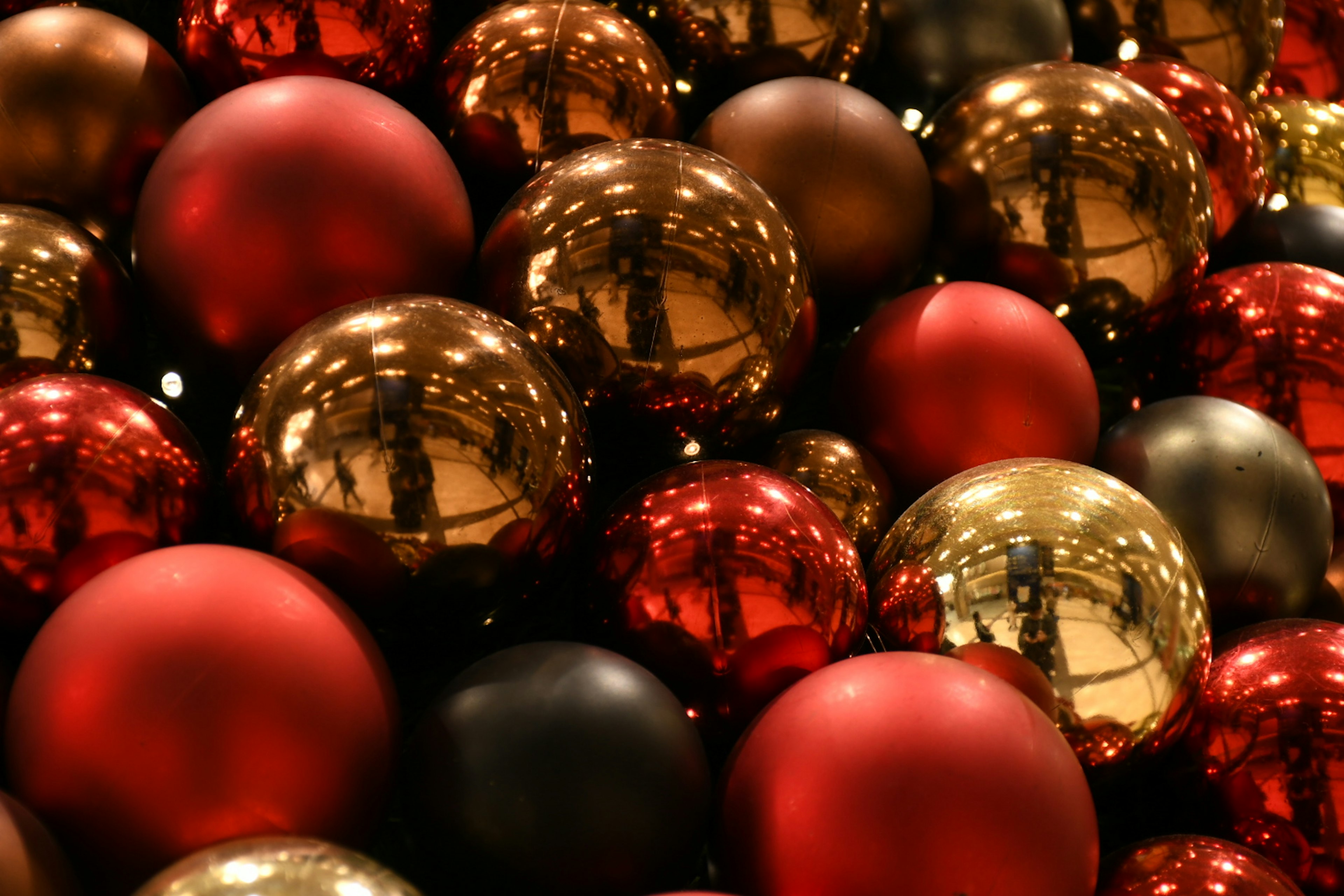 Red and gold Christmas ornaments overlapping each other