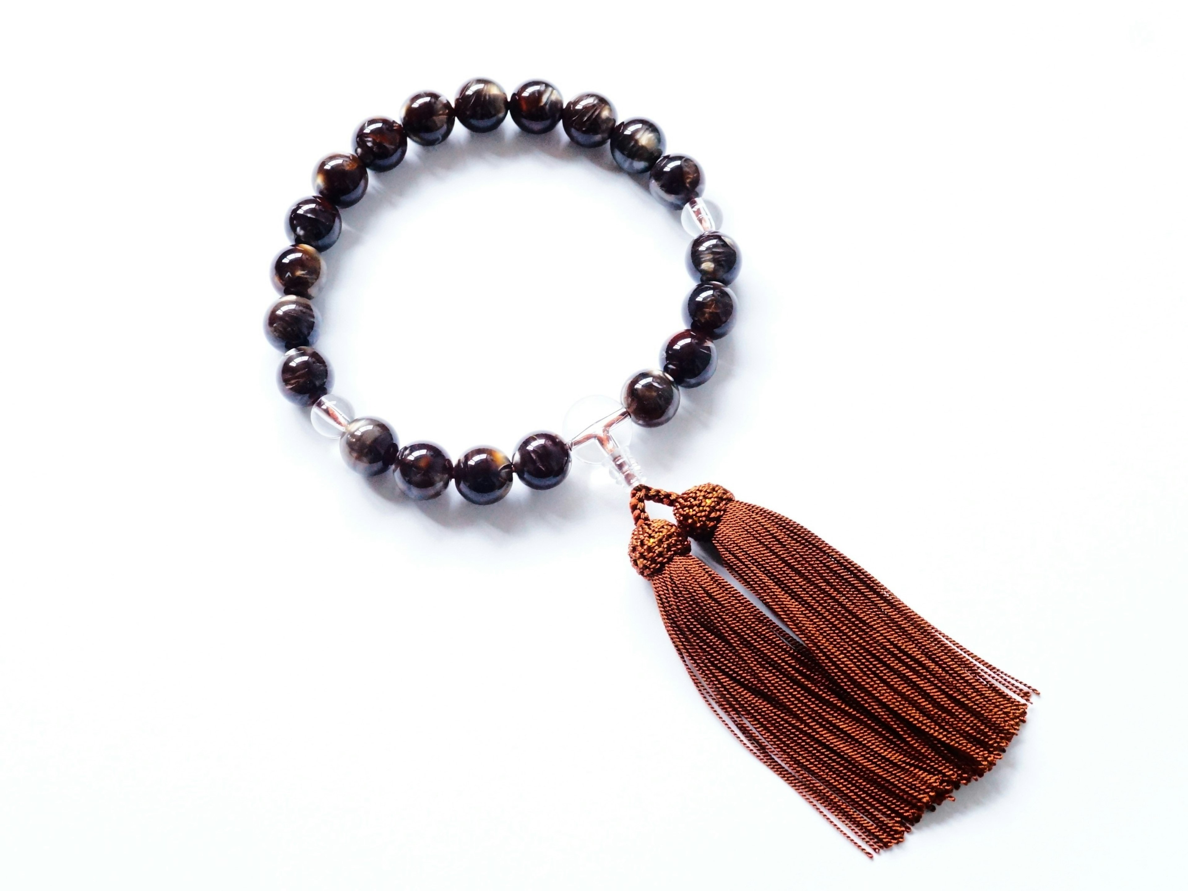 Beaded bracelet with brown tassel