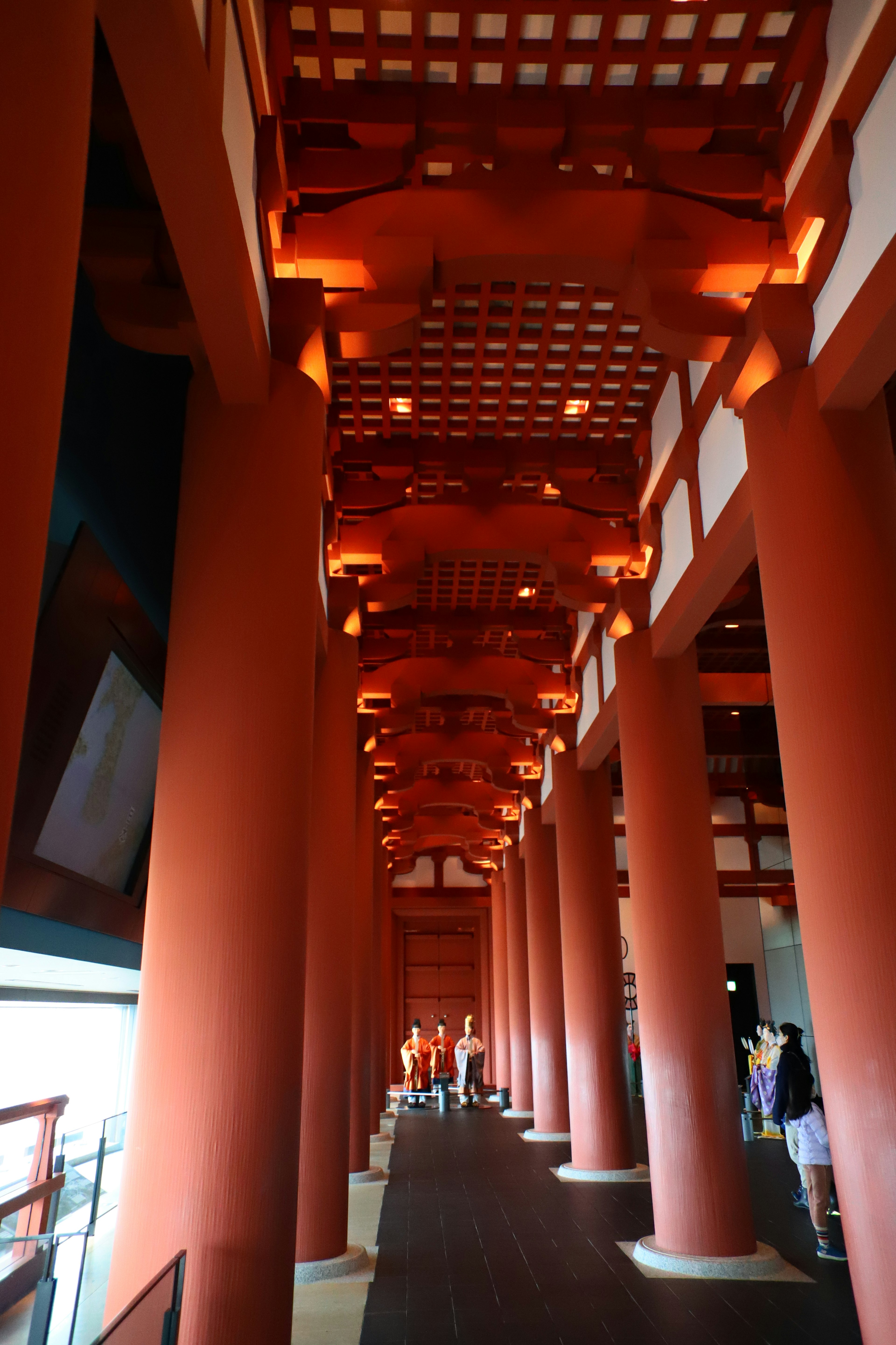 Long corridor with red pillars and ceiling