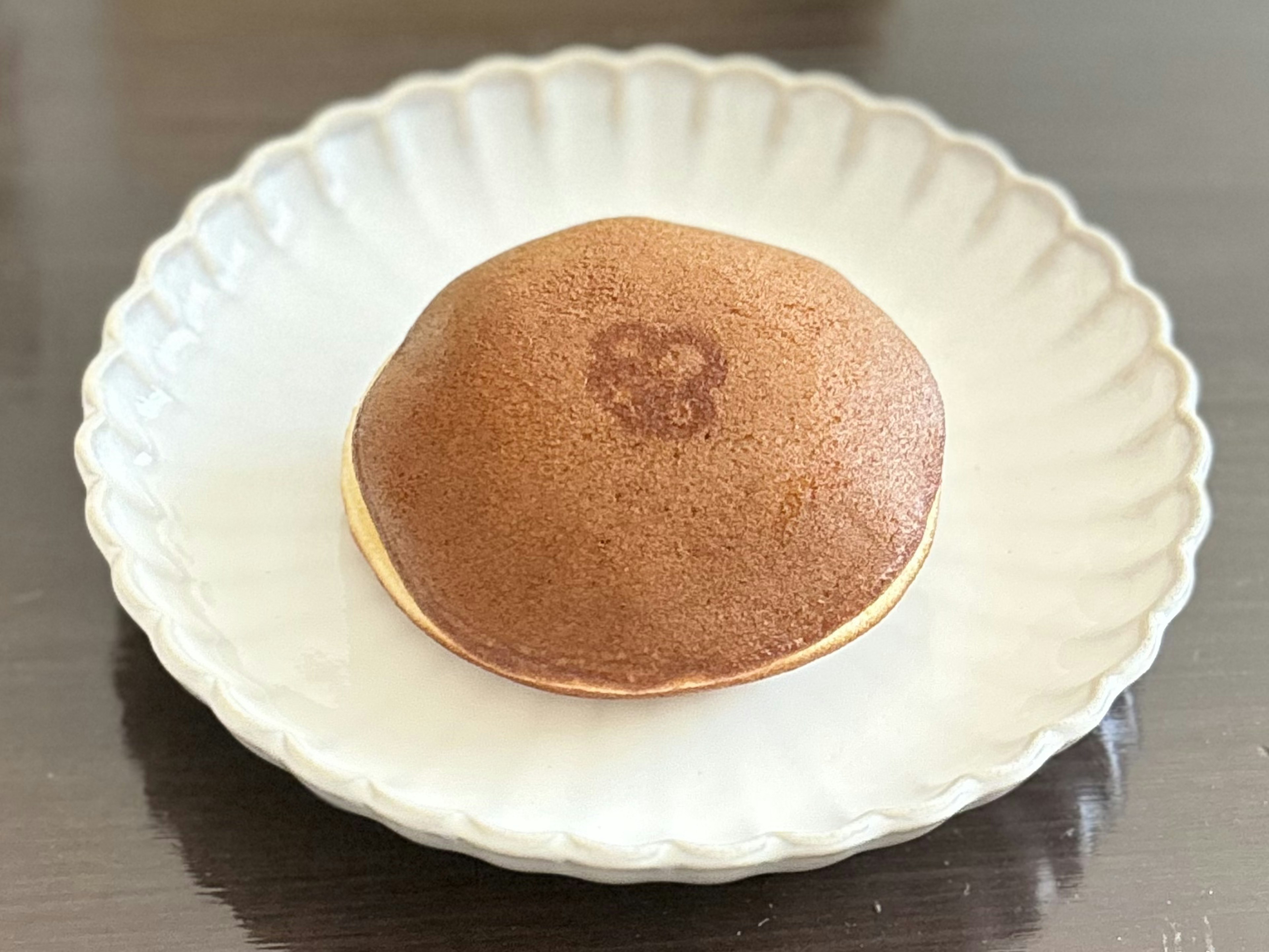 Brown Japanese confection on a white plate