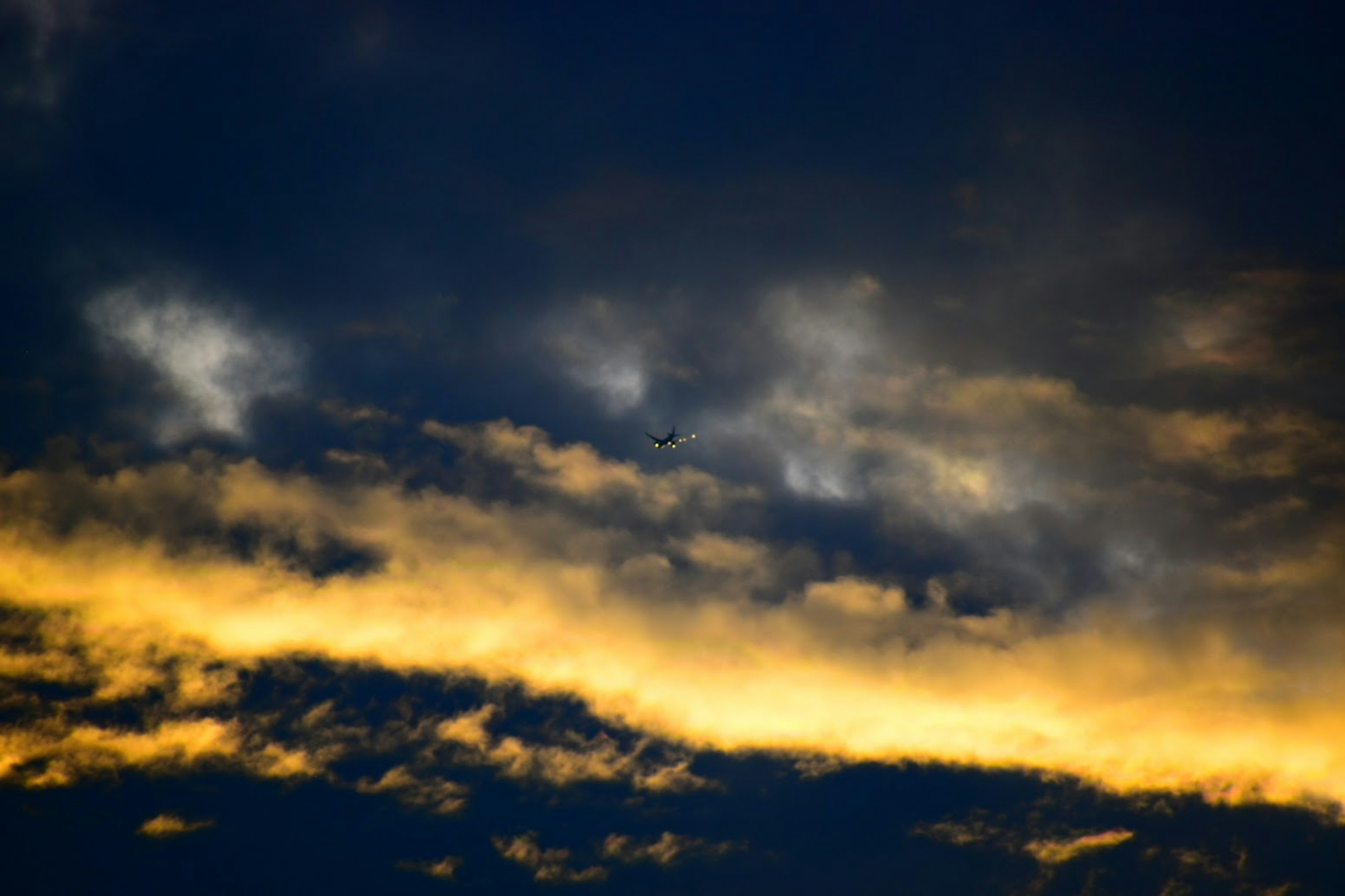 Dark sky with clouds and orange sunset