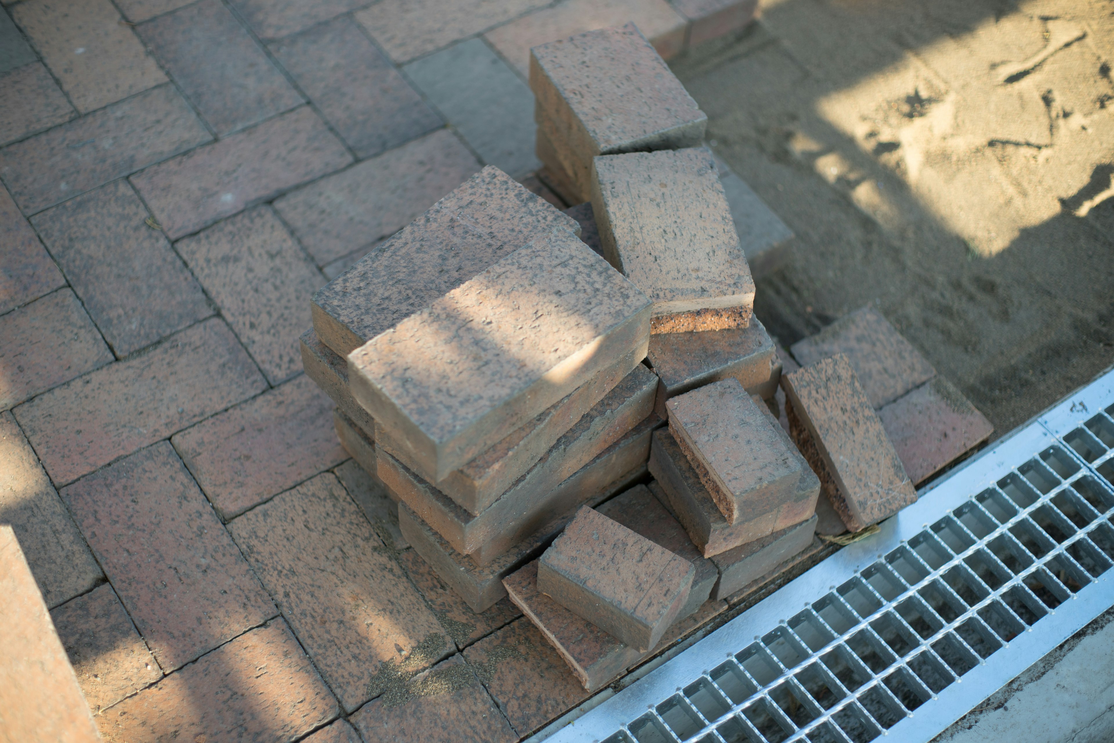 Stacked concrete blocks on a paved surface