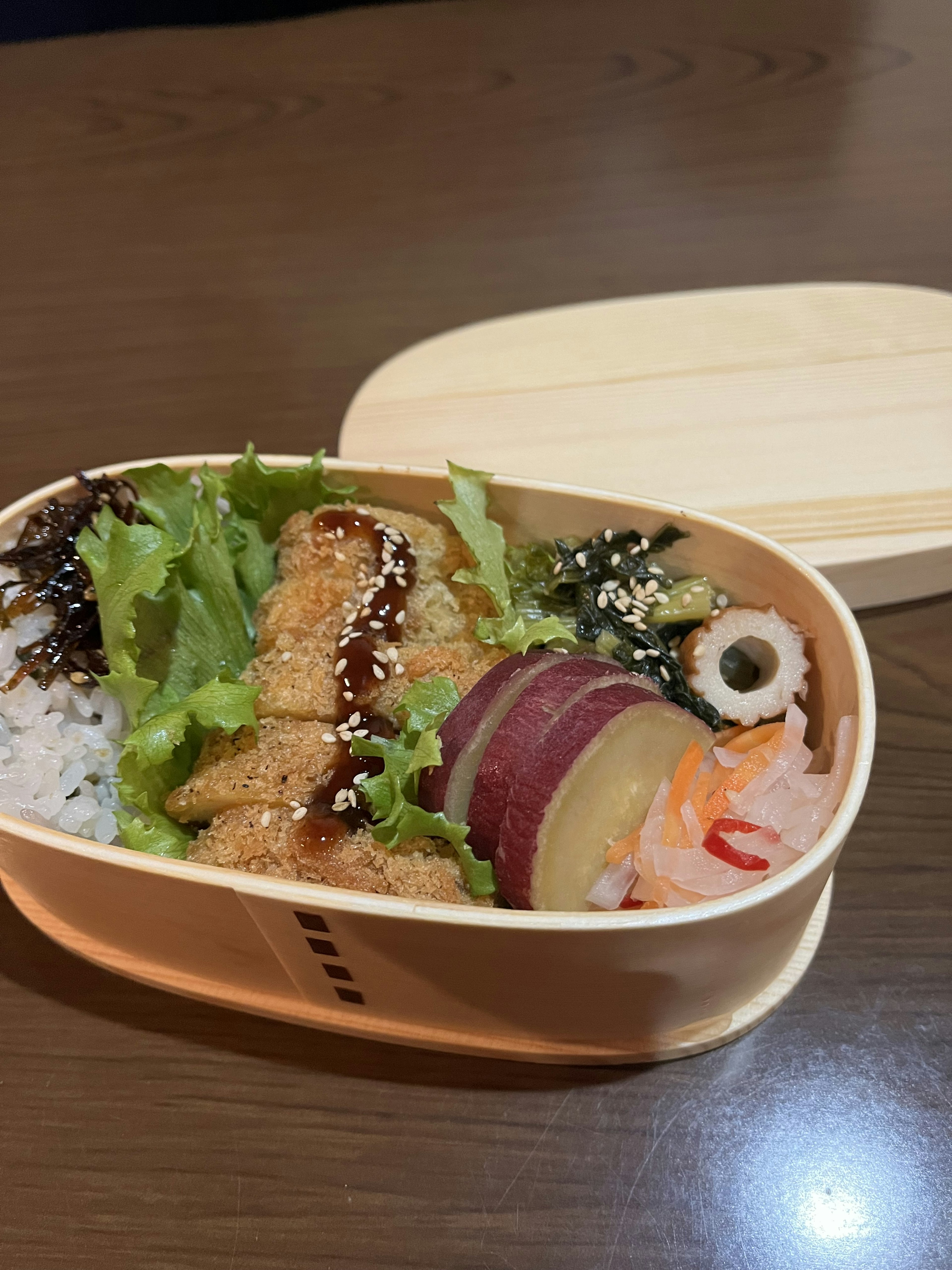 Bento box containing fried food and vegetables