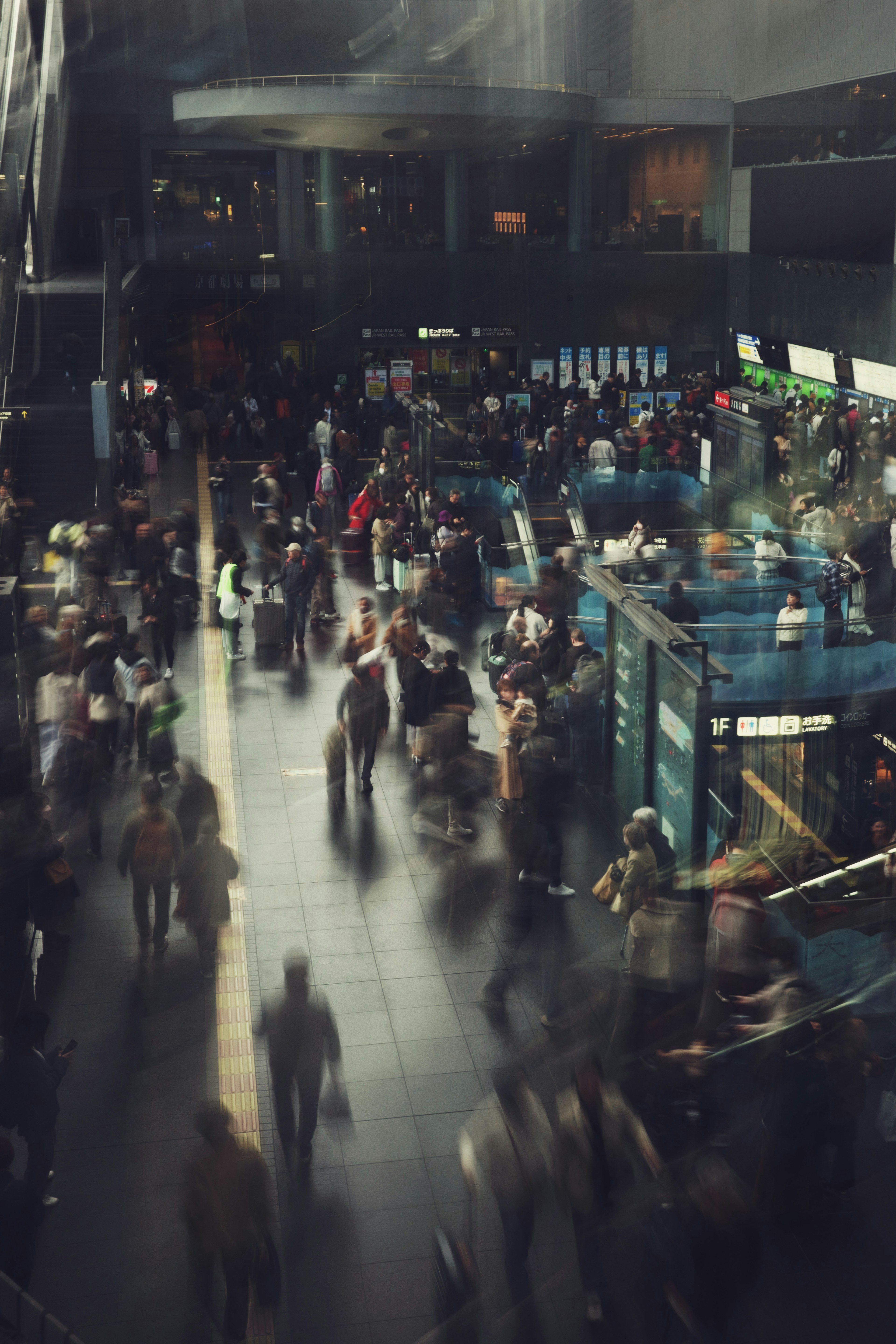 Crowd of people moving inside a busy station