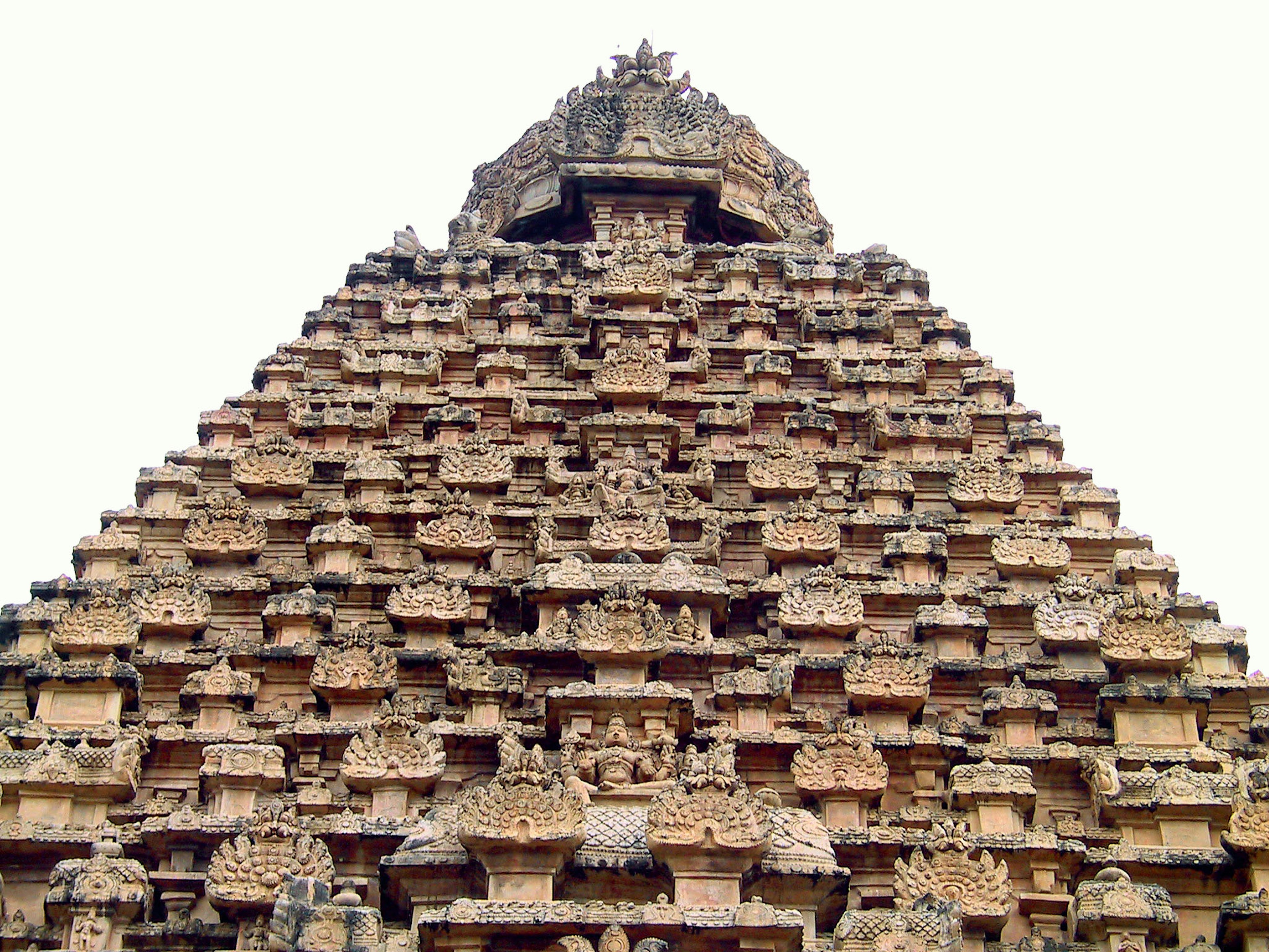 Detailed carvings on a pyramid-shaped temple tower