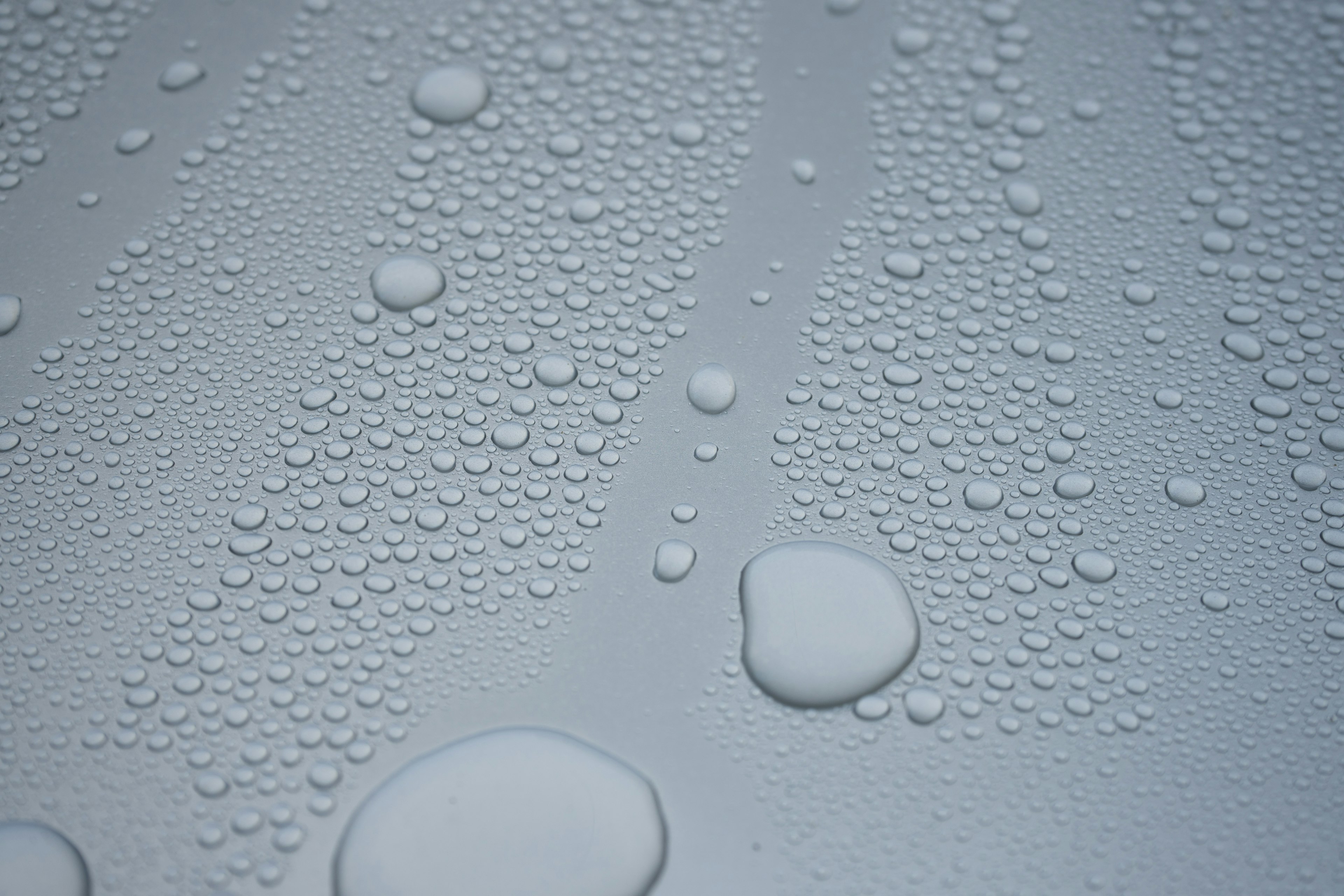 Close-up of water droplets on a smooth surface