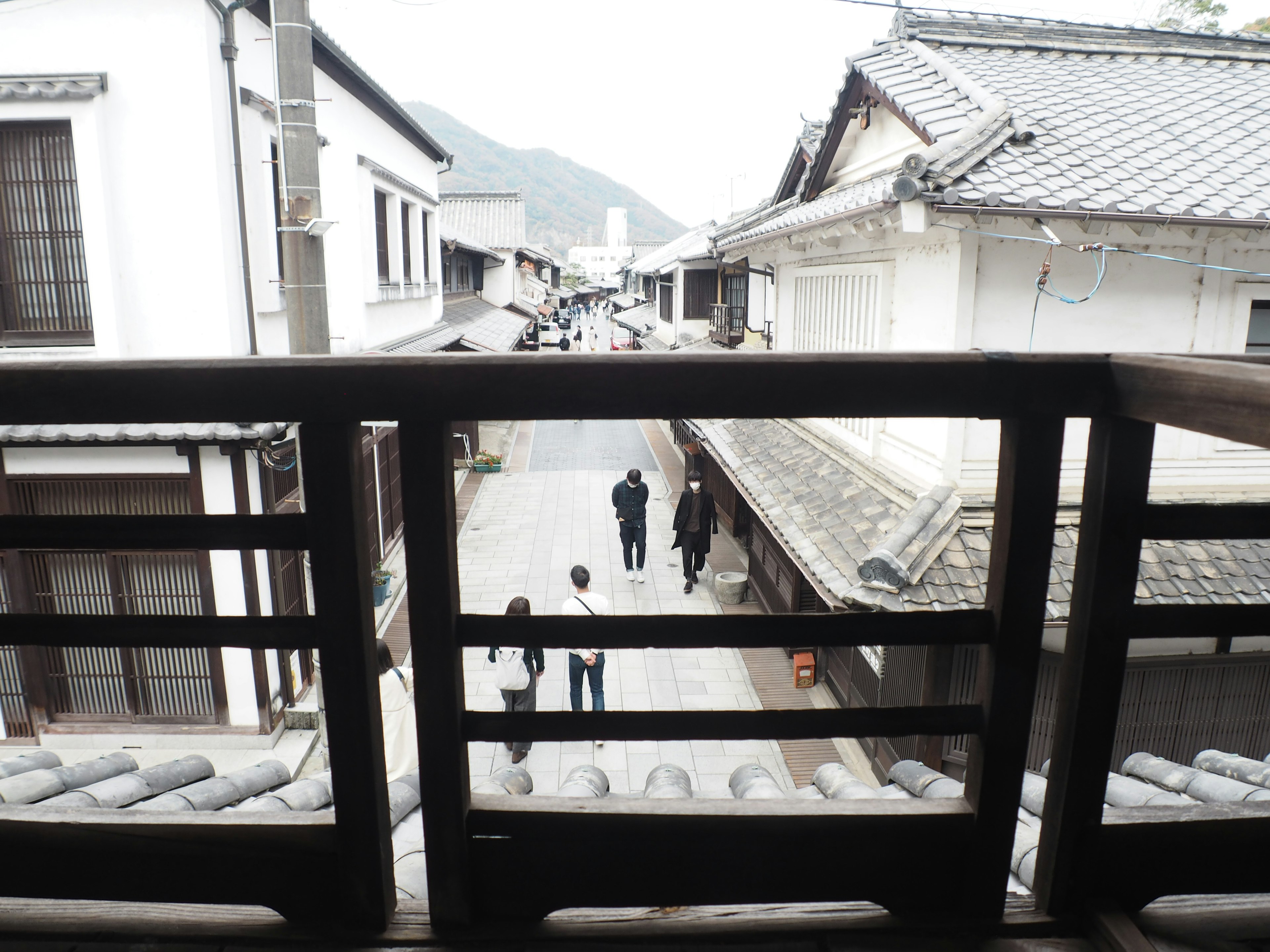 View of a historic street with wooden railing