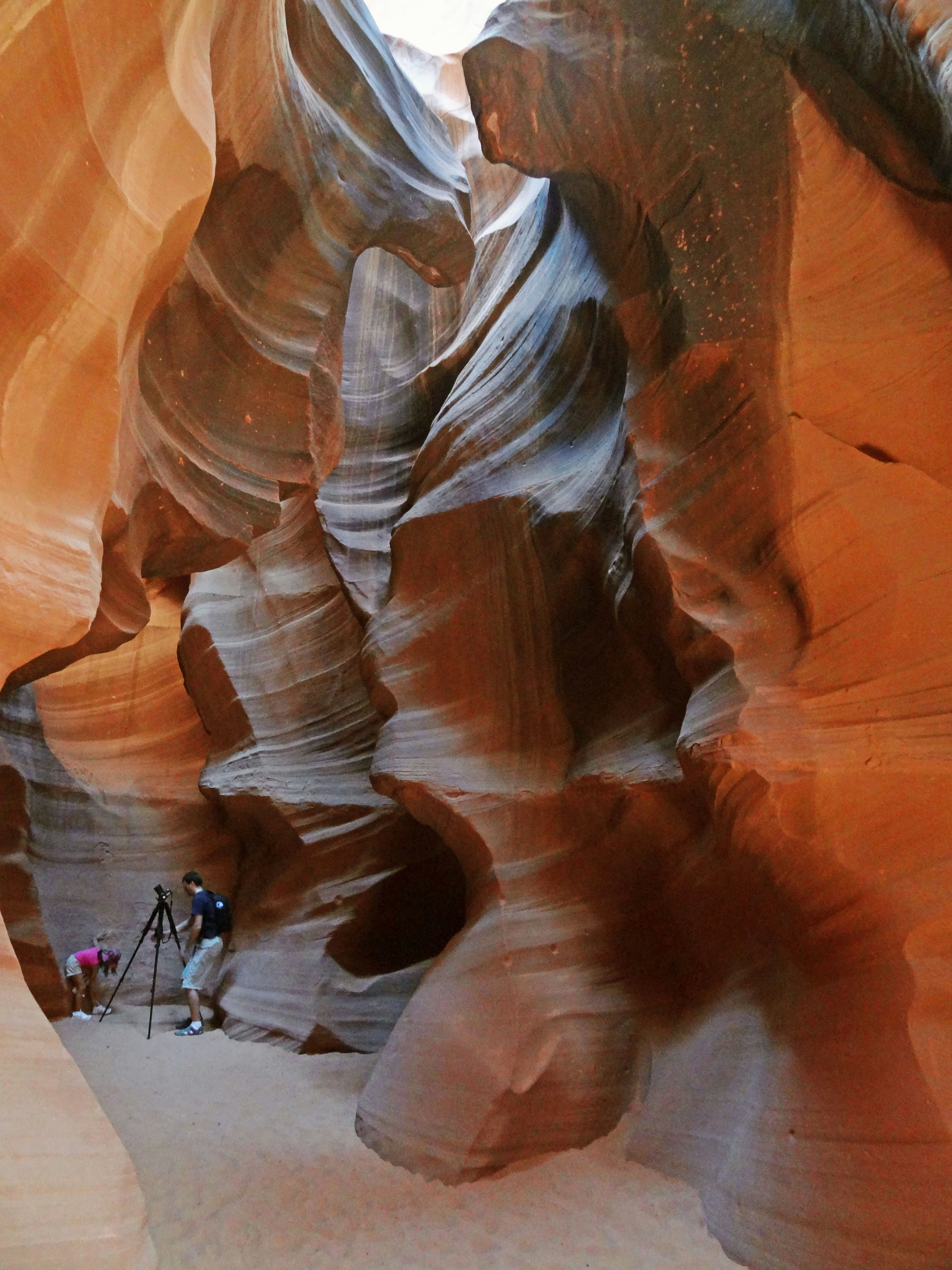 Interior view of Antelope Canyon showcasing stunning rock formations and photographers