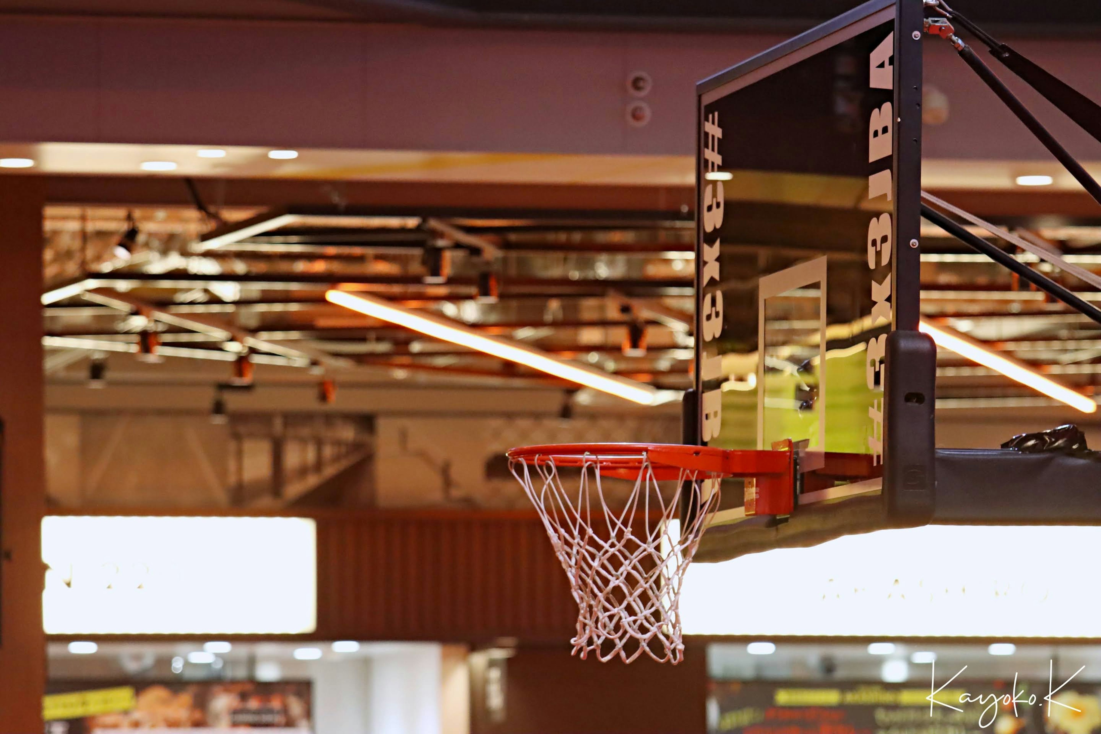 Basketball hoop and net in a gym setting