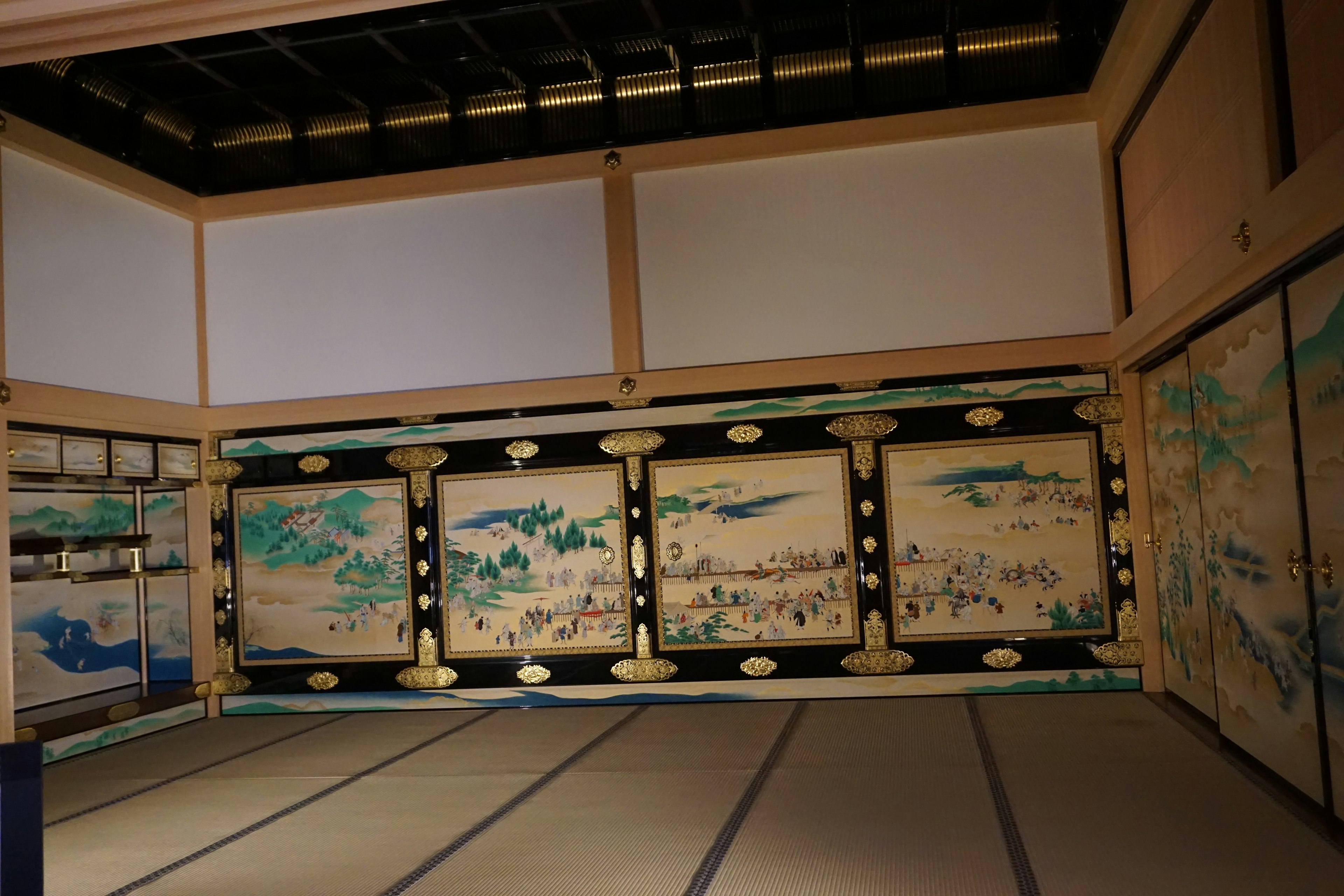 Interior of a traditional Japanese room featuring intricate folding screens