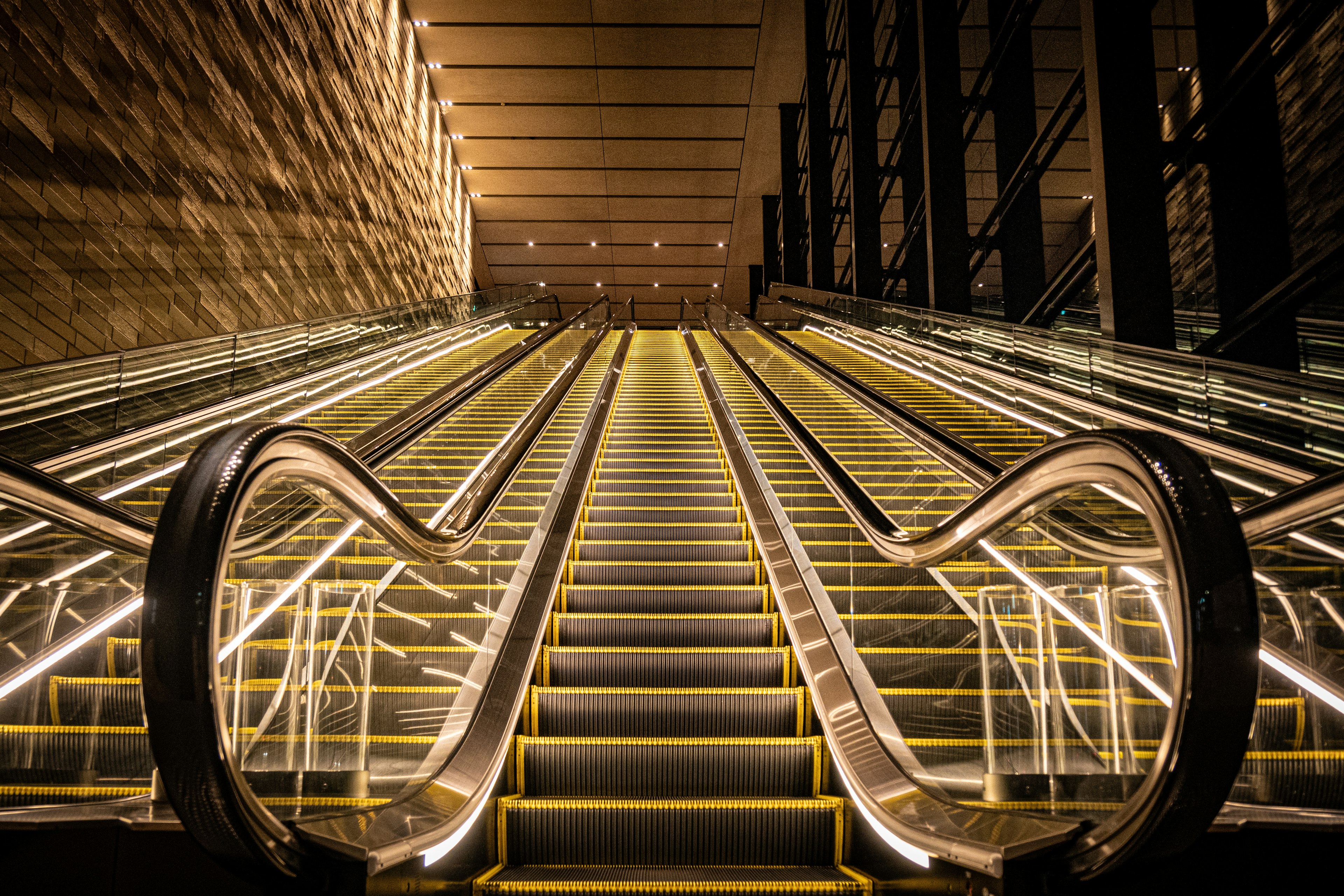 Modern escalator with bright lighting and sleek design