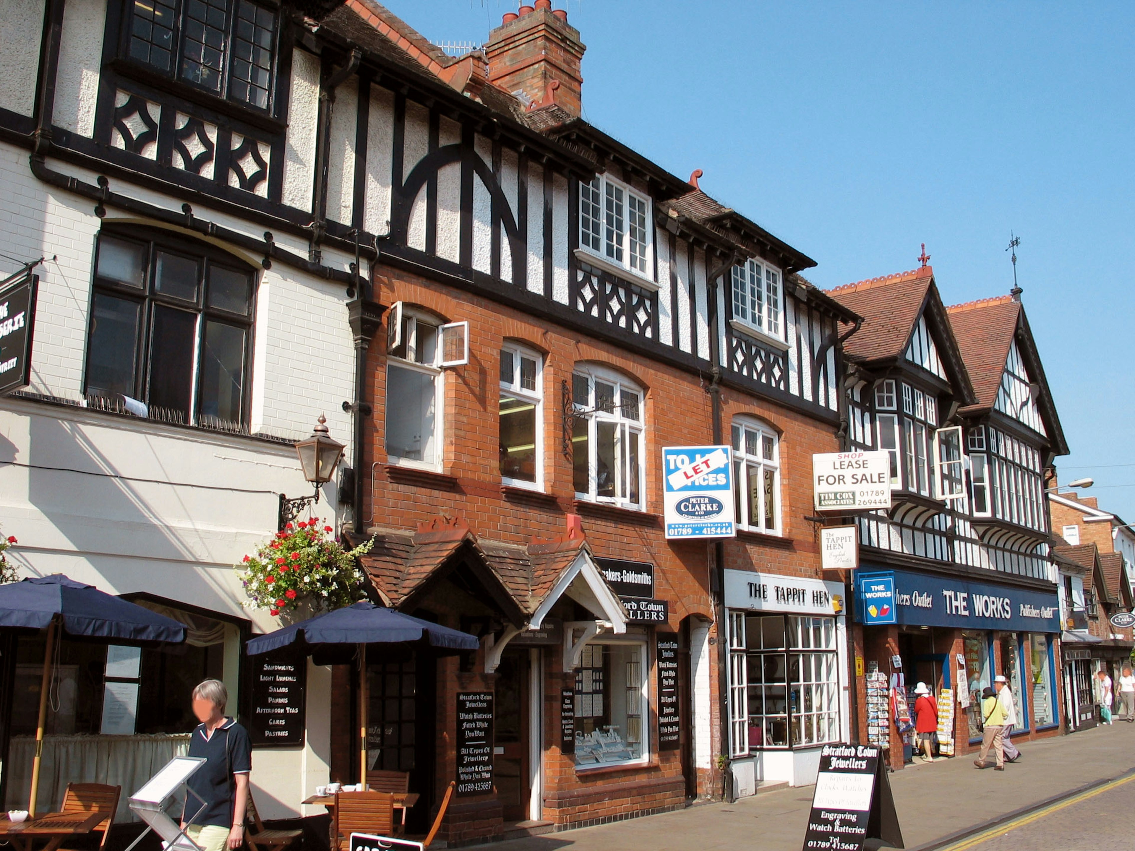 Street view featuring traditional English buildings with timber framing