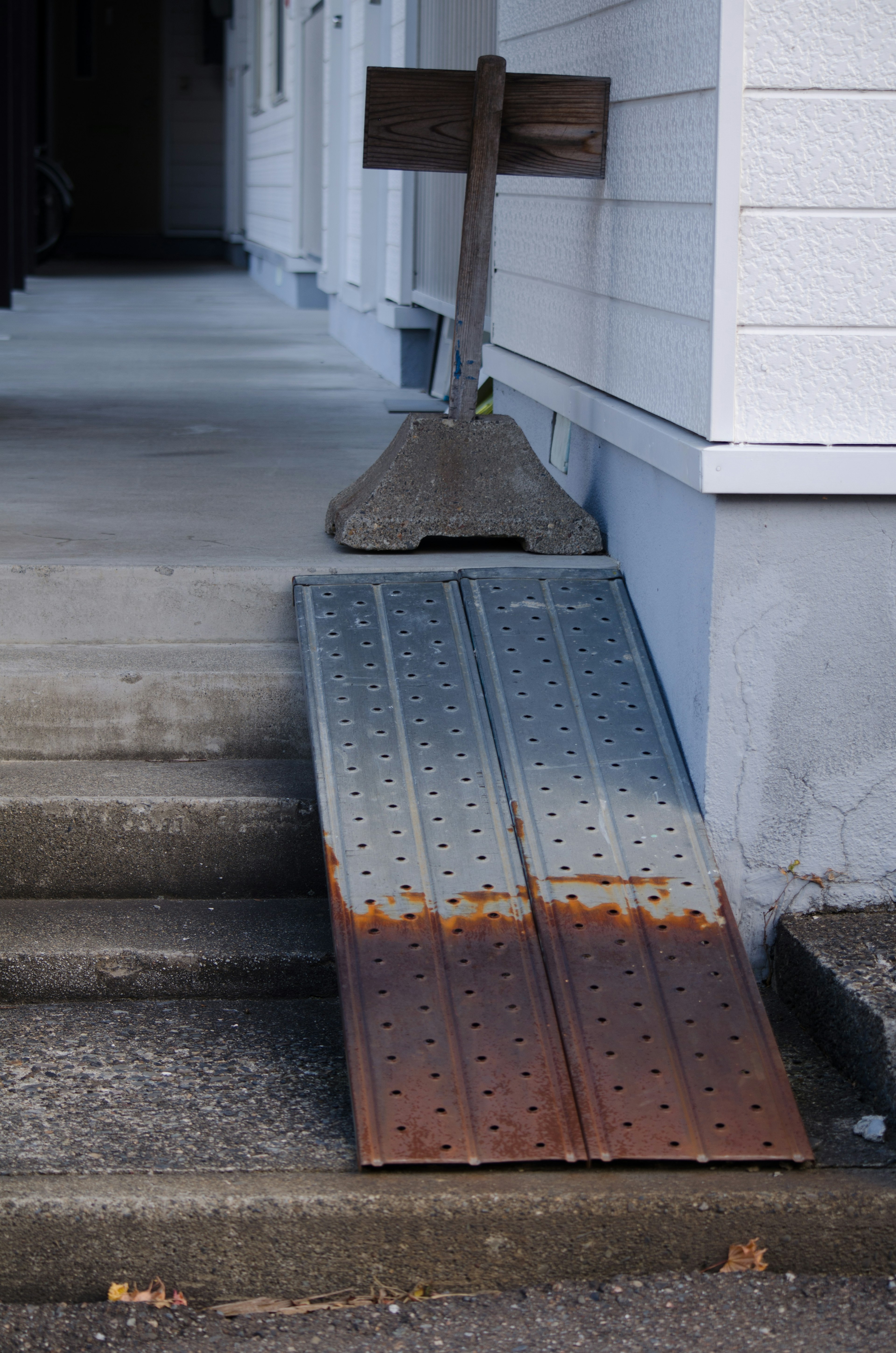 Metal ramp positioned in front of stairs