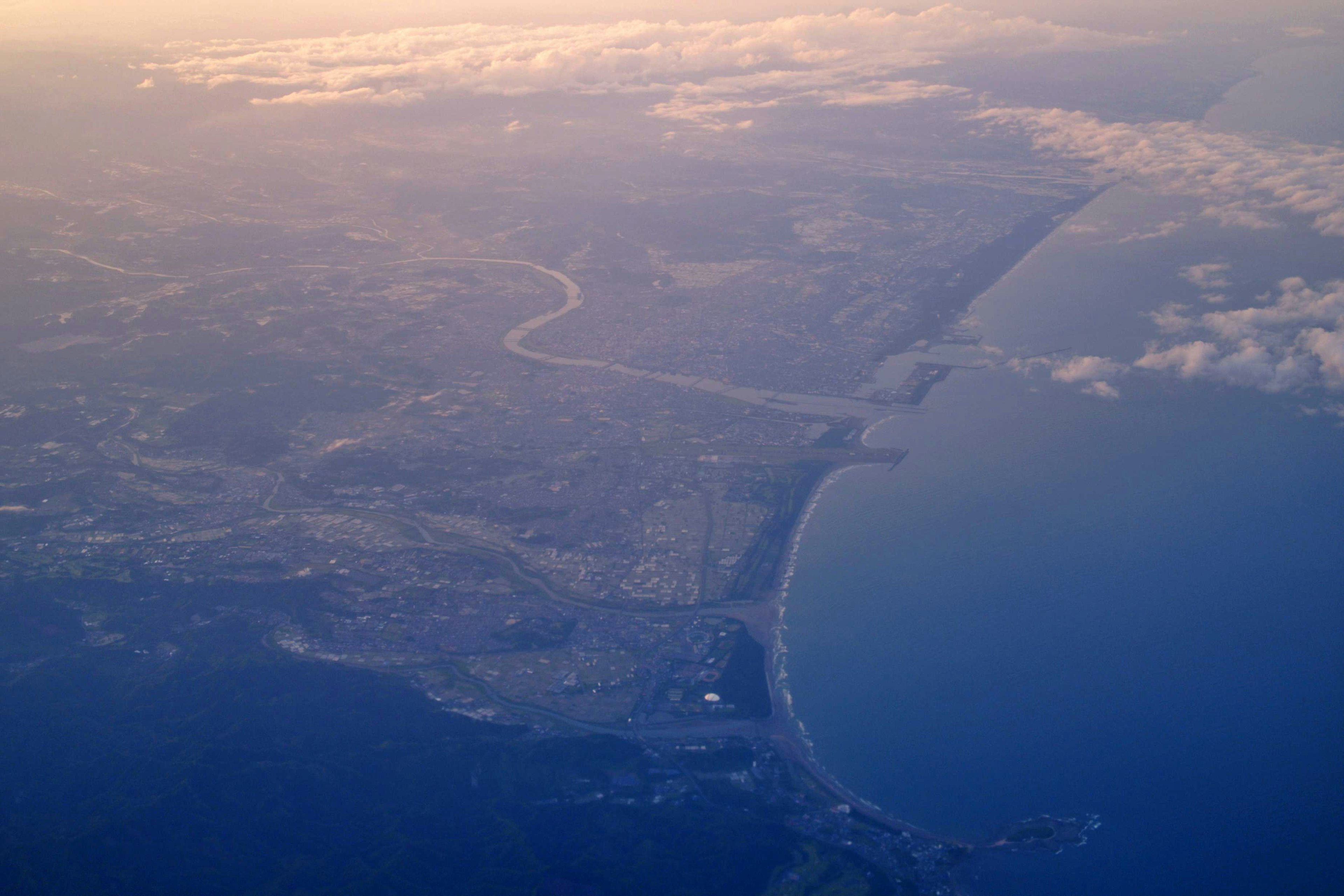 Aerial view of coastline and urban landscape