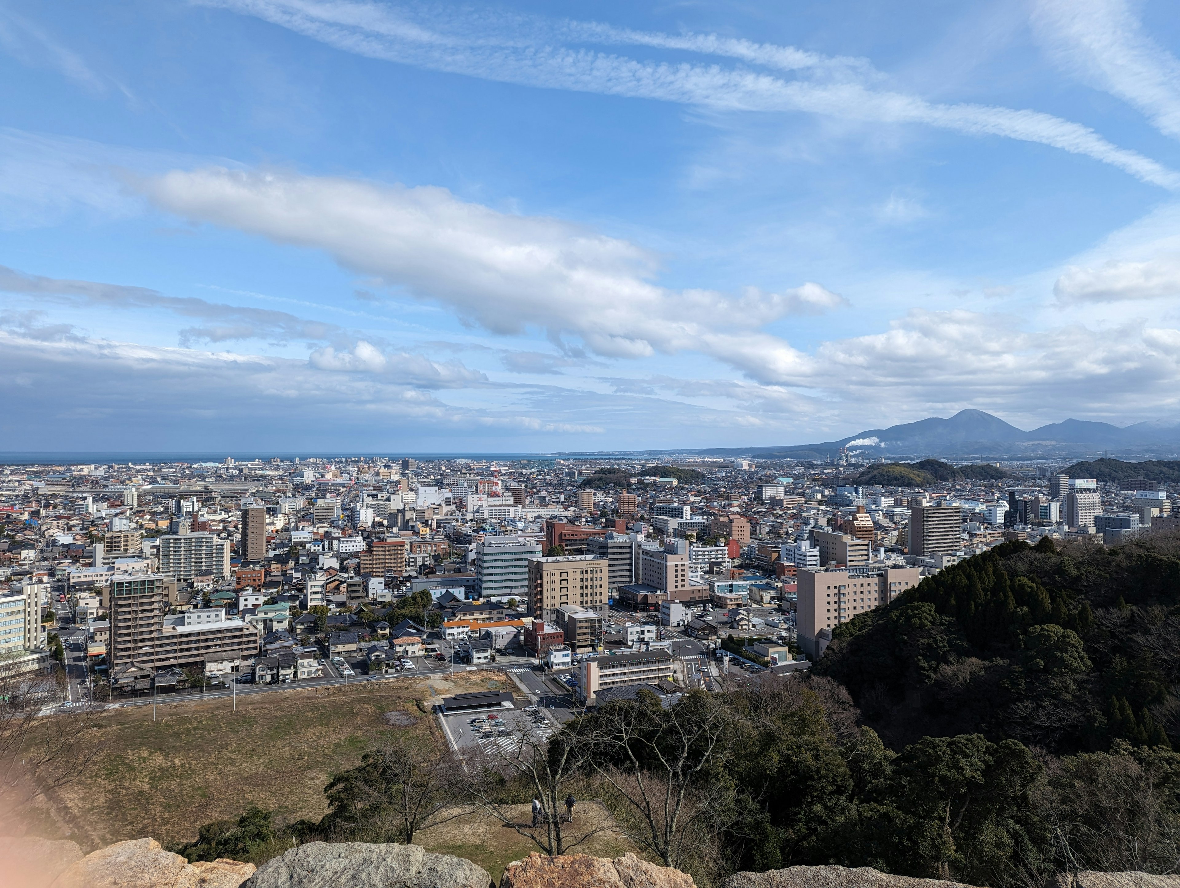 Cityscape view featuring buildings and mountains