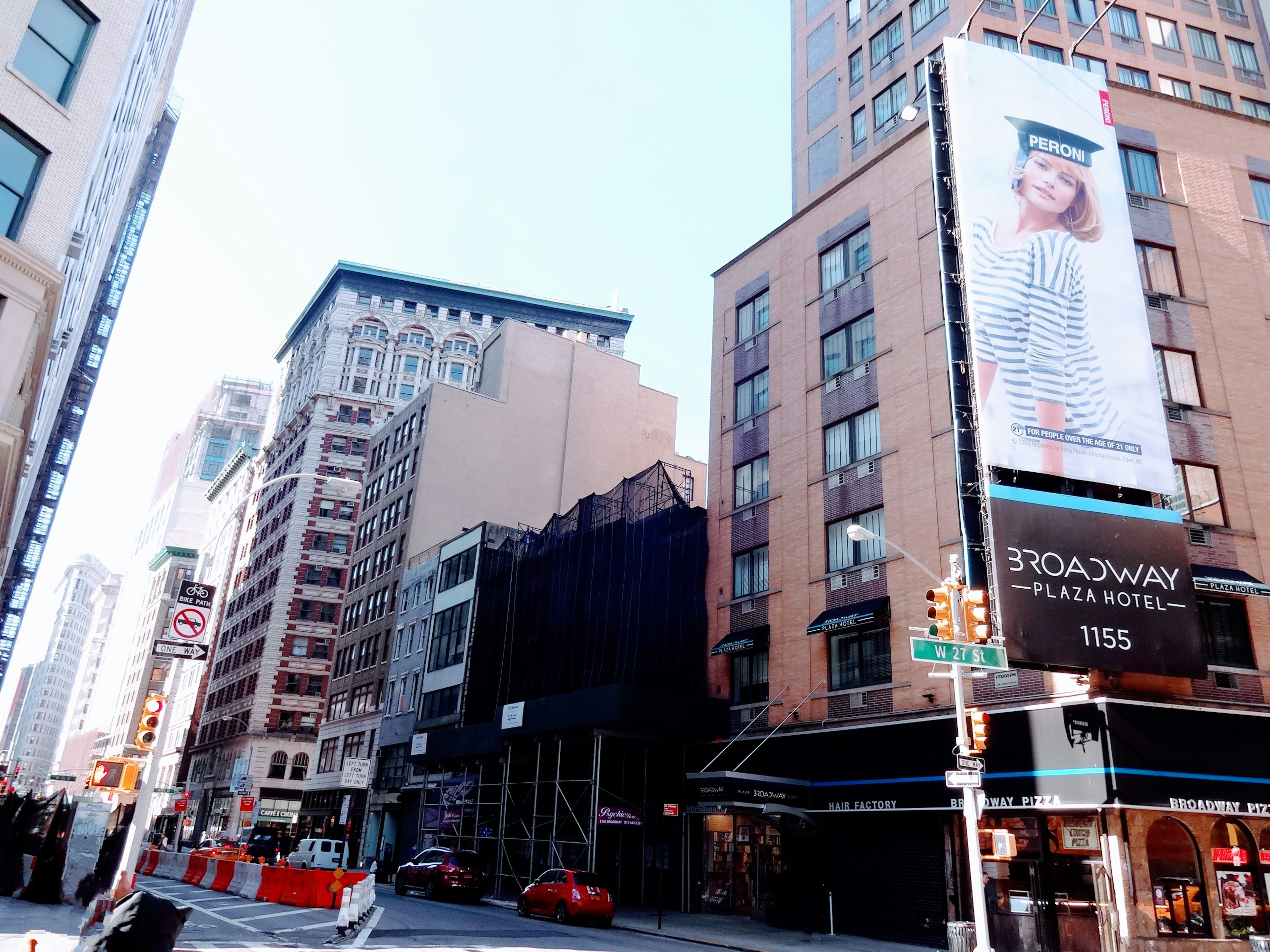 Street corner with buildings and large advertising billboard