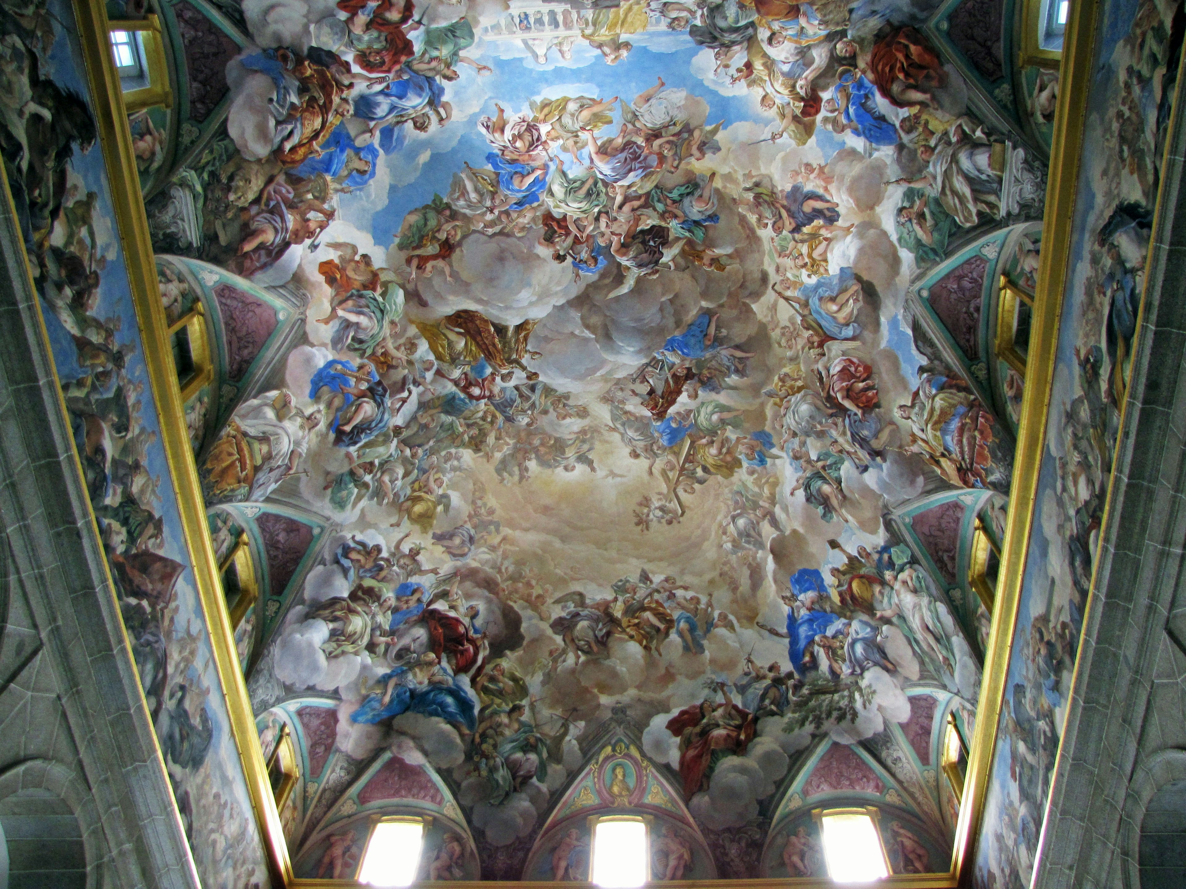 Detailed depiction of the Sistine Chapel ceiling featuring vibrant colors and mythological scenes