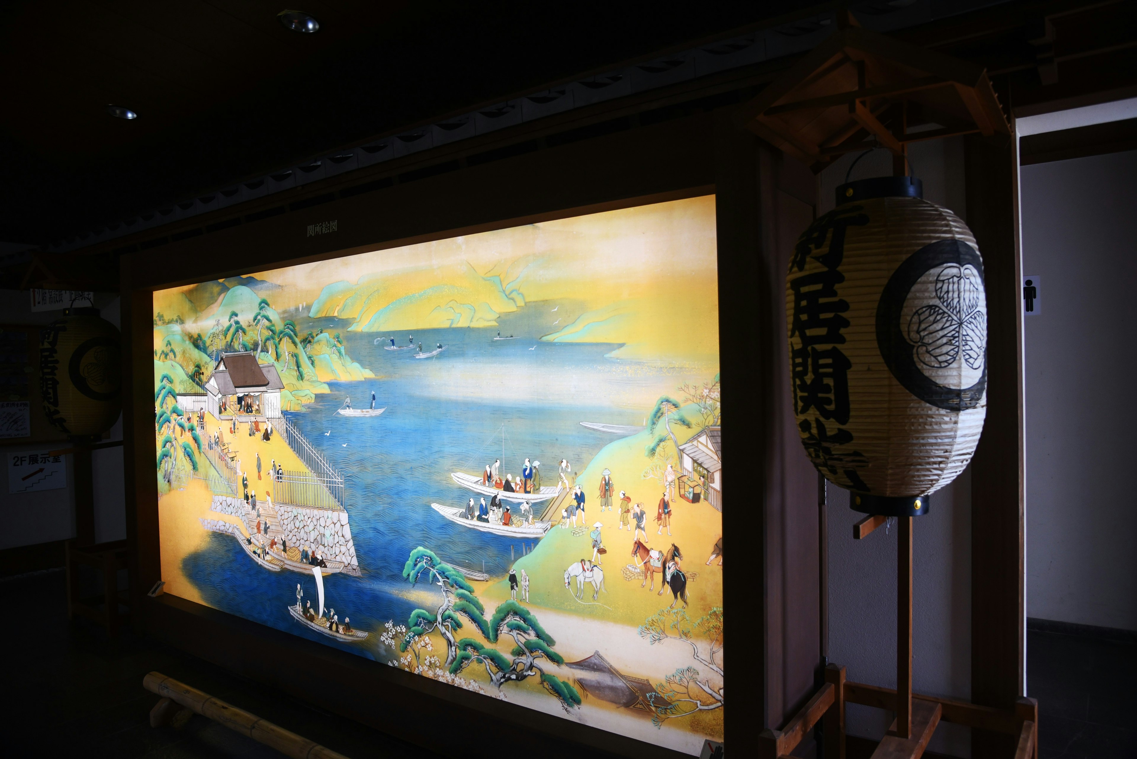 Interior view featuring a Japanese landscape painting of a blue lake and boats