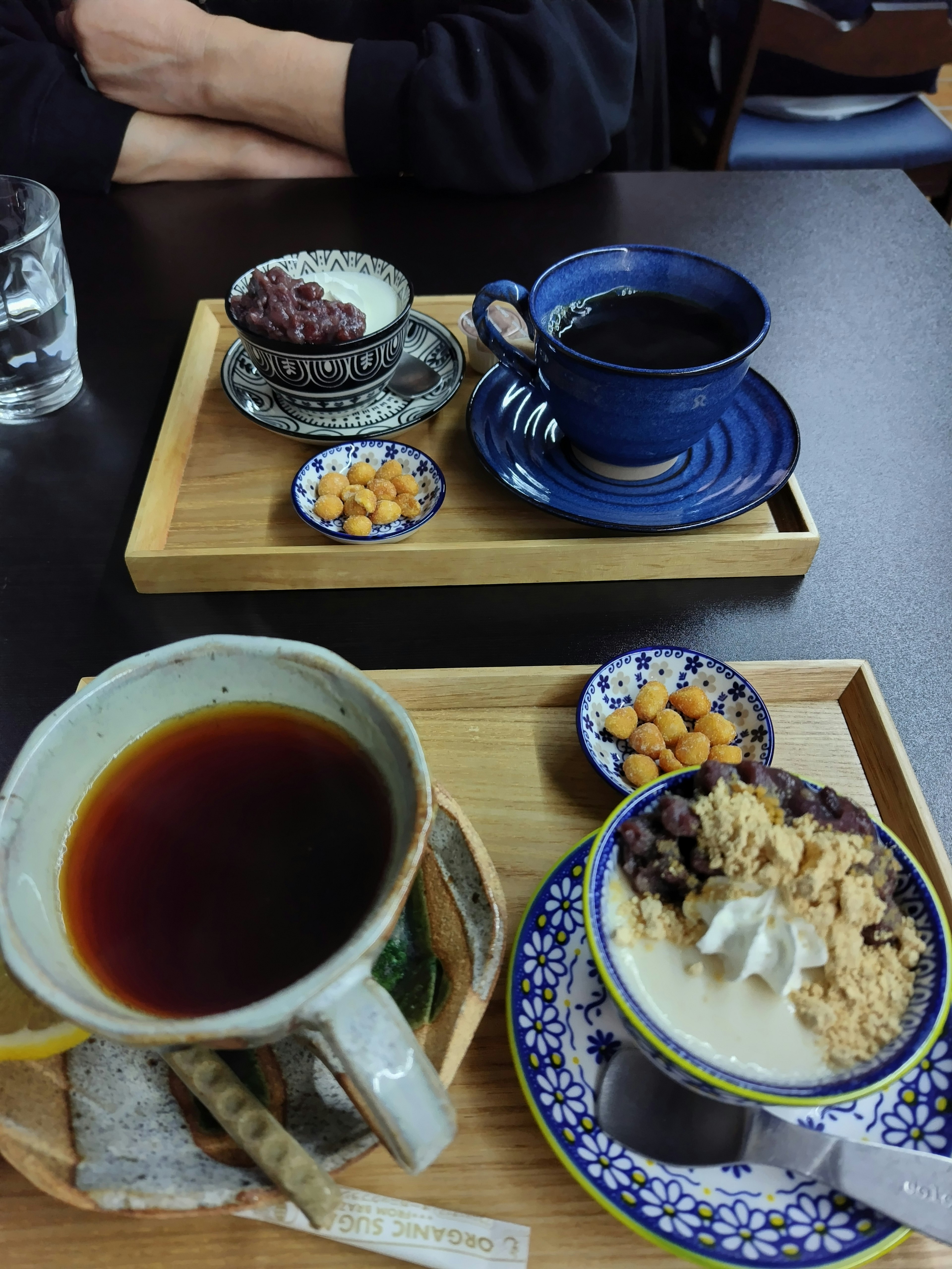 A table set with coffee and dessert featuring sweet red beans and ice cream