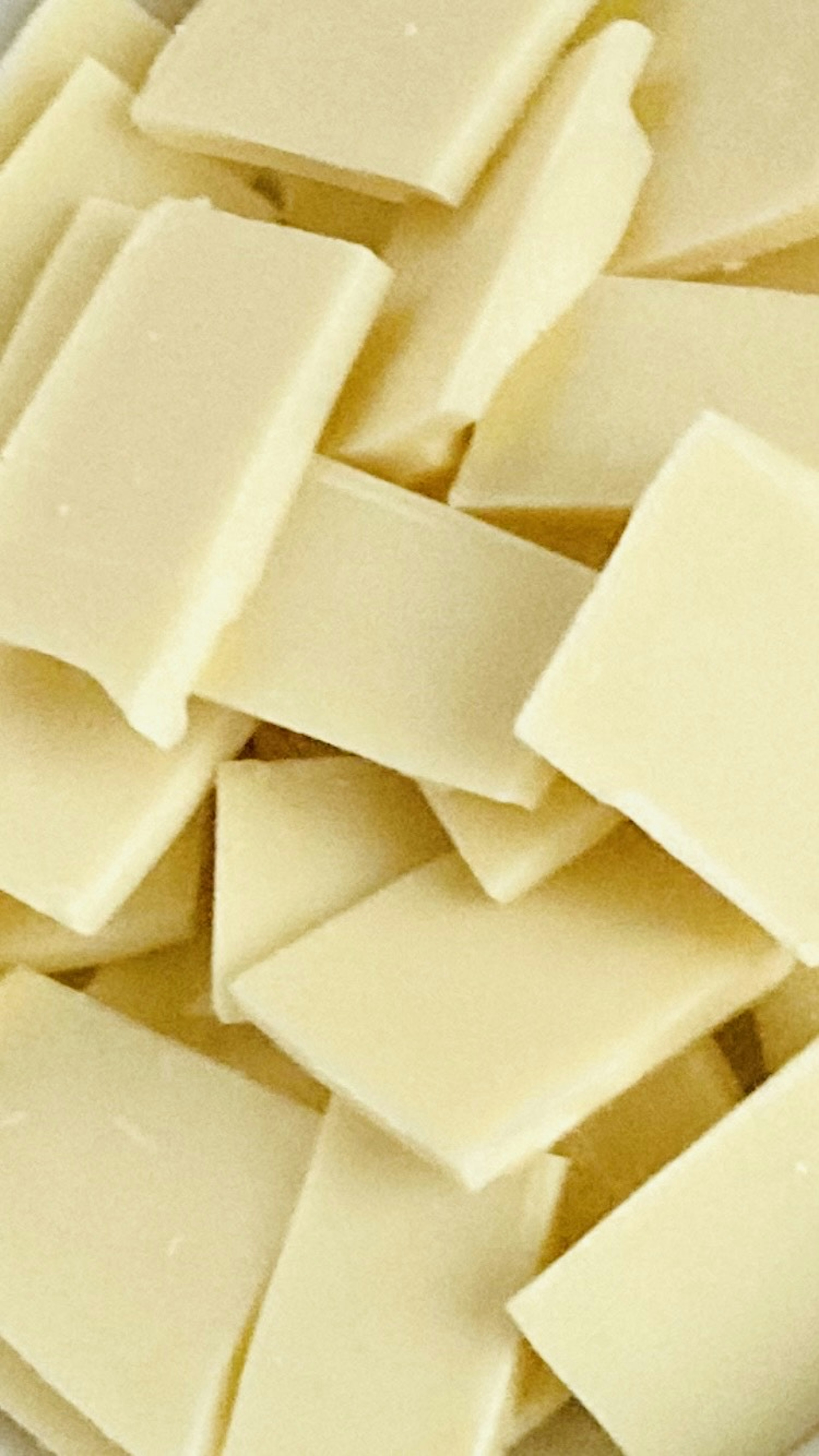 Close-up of white chocolate squares stacked together