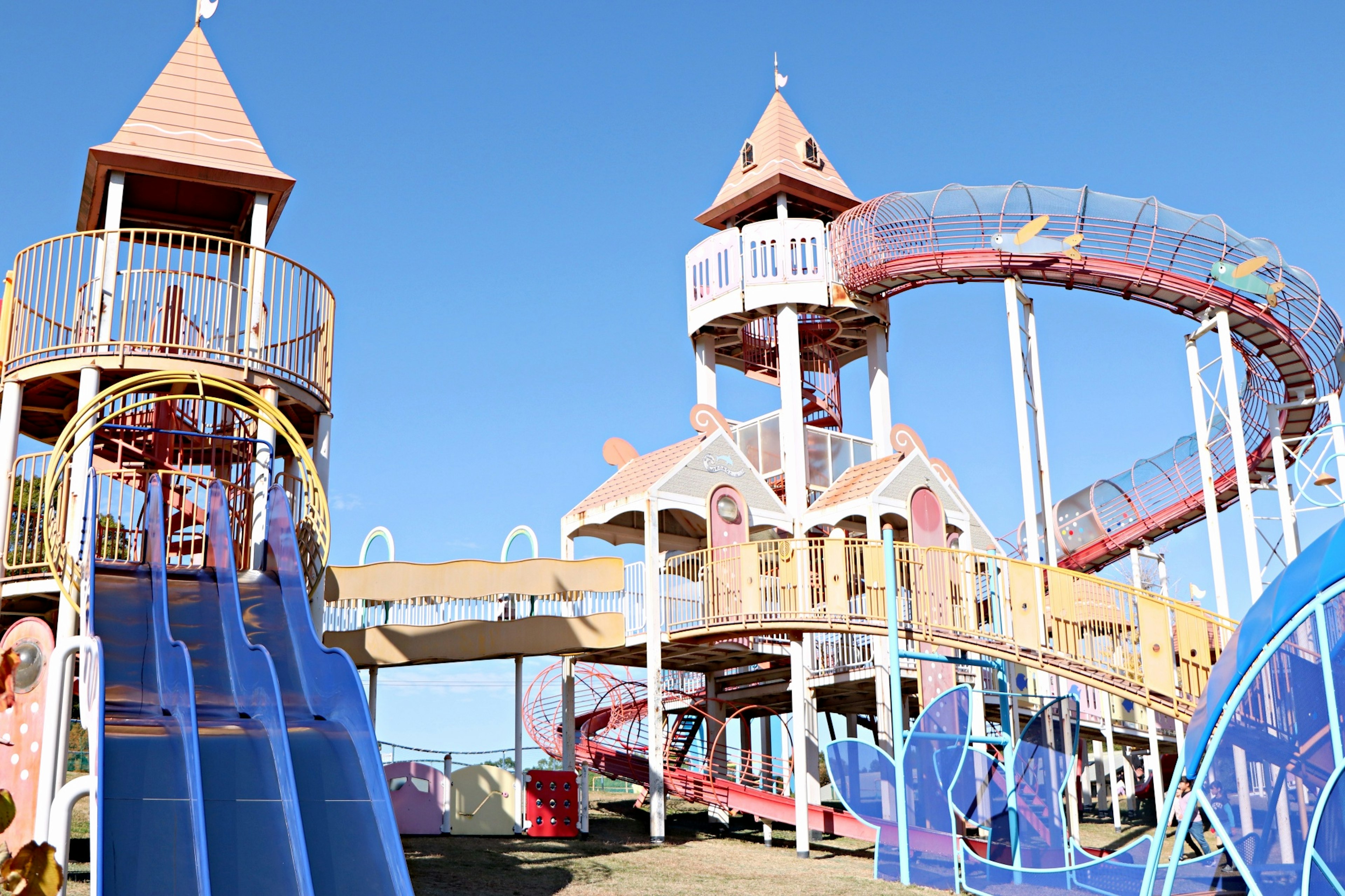 Colorful playground featuring slides and towers