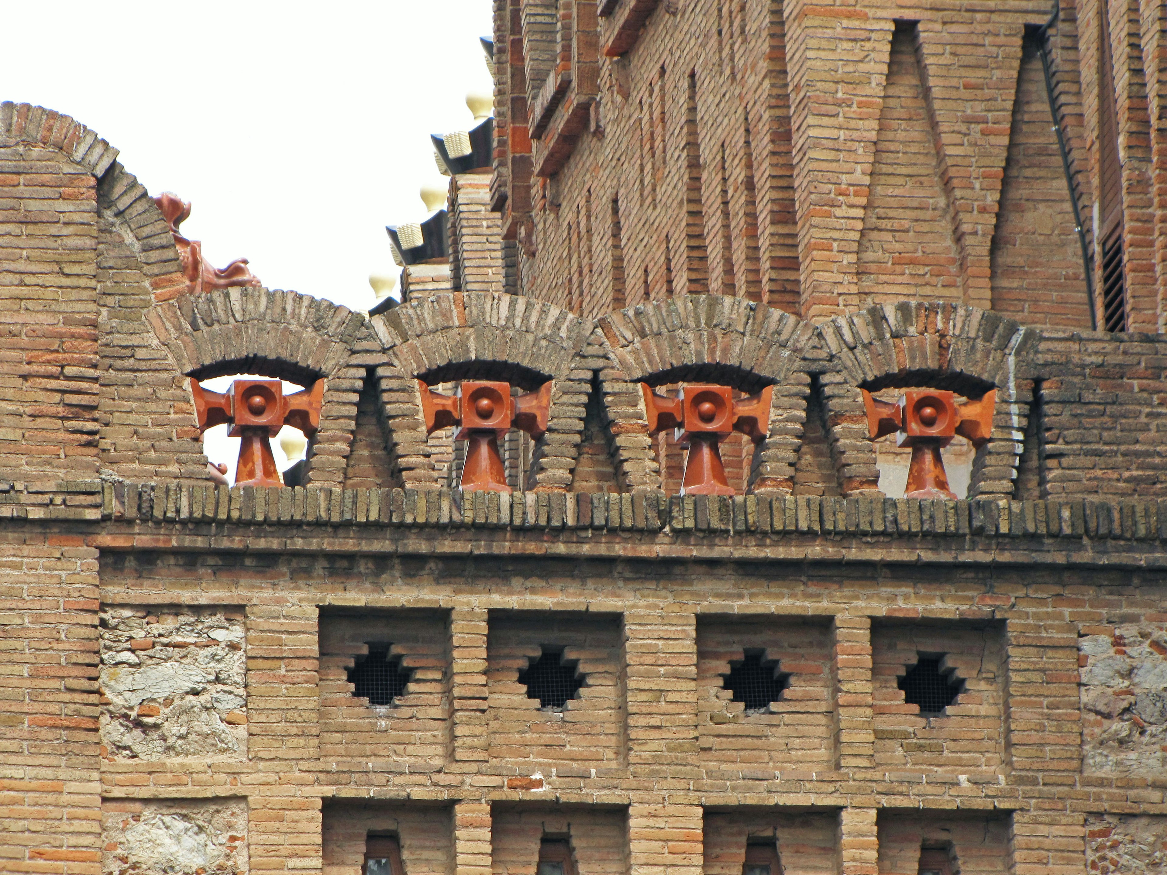 Decorative design and openings on a brick wall of a building