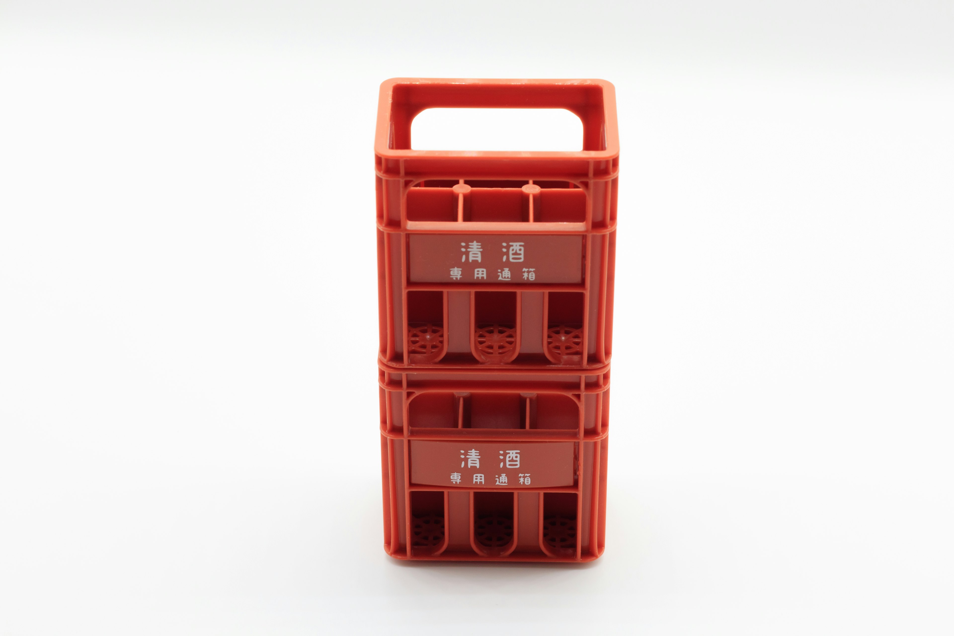 Two stacked red plastic storage crates with handles