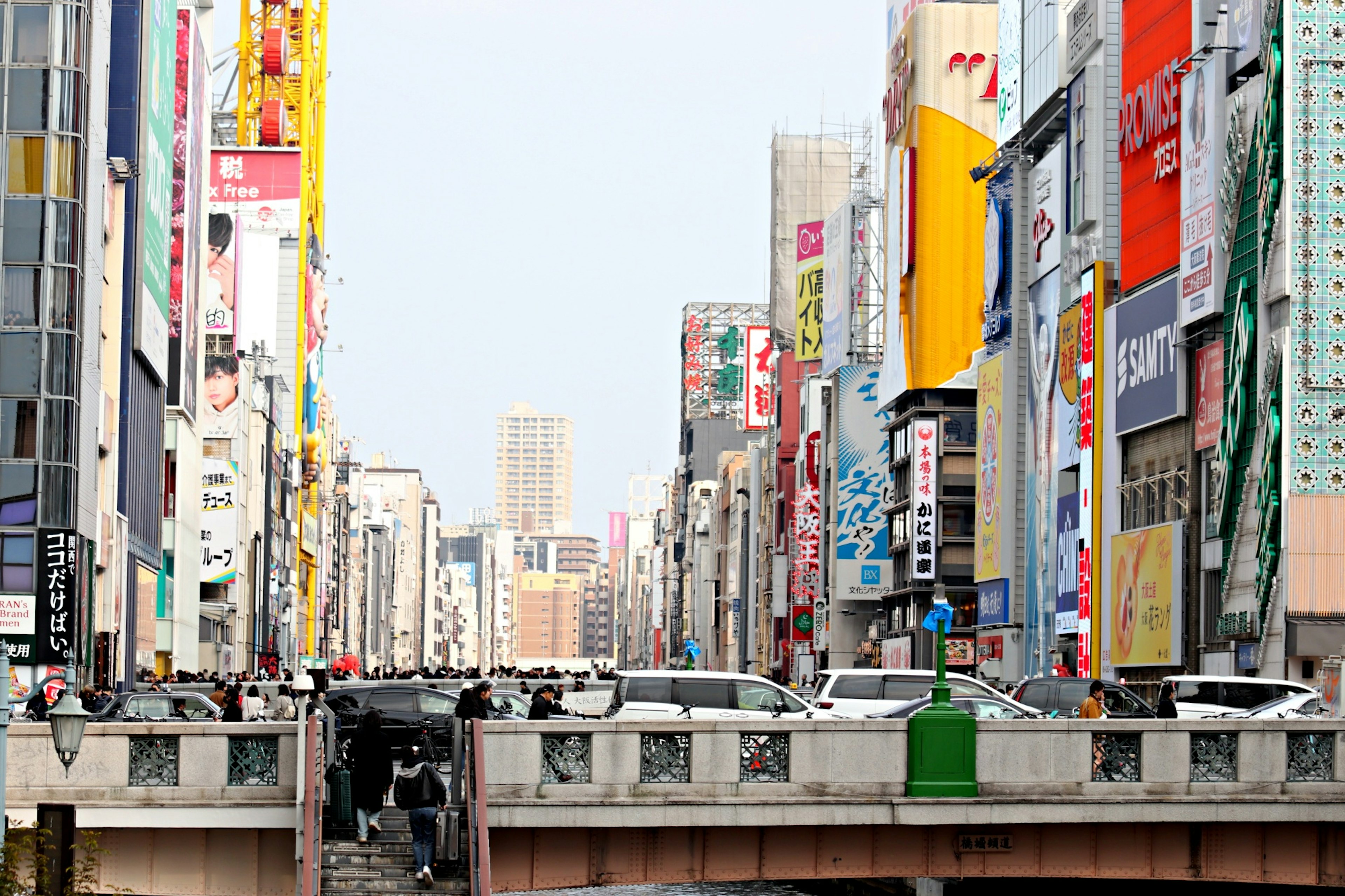 Busy urban scene featuring a bridge and surrounding skyscrapers