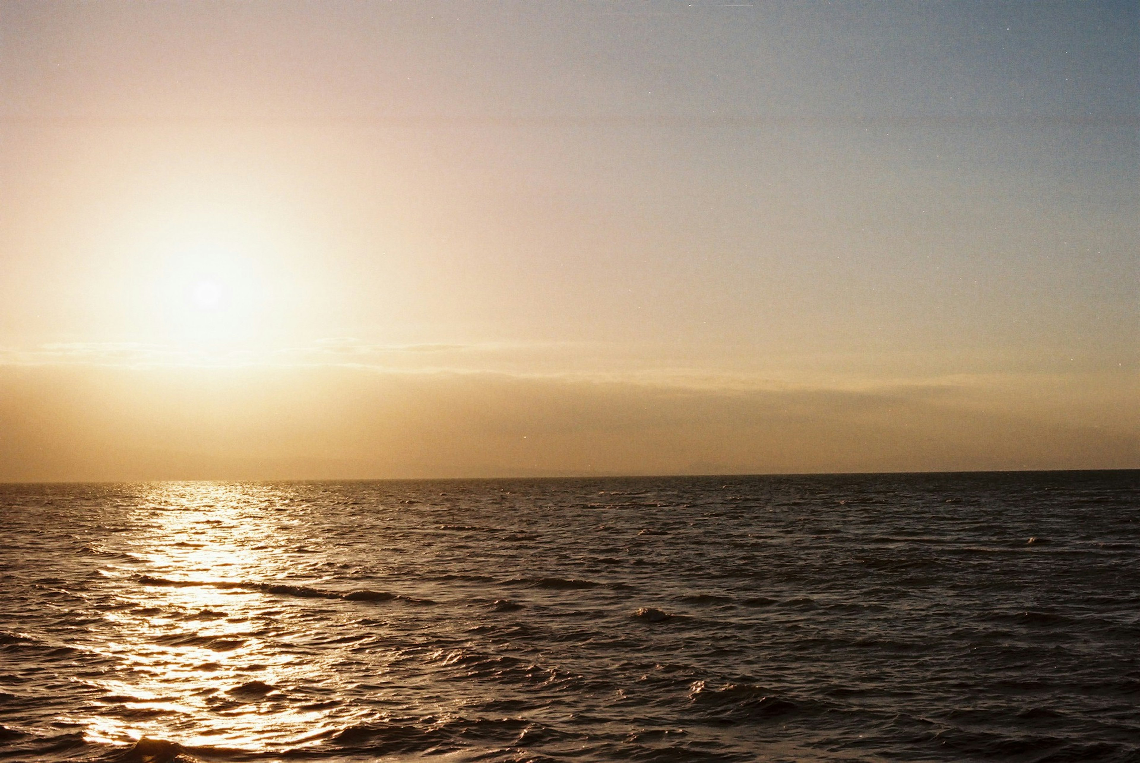 A beautiful landscape of the sunset over the ocean