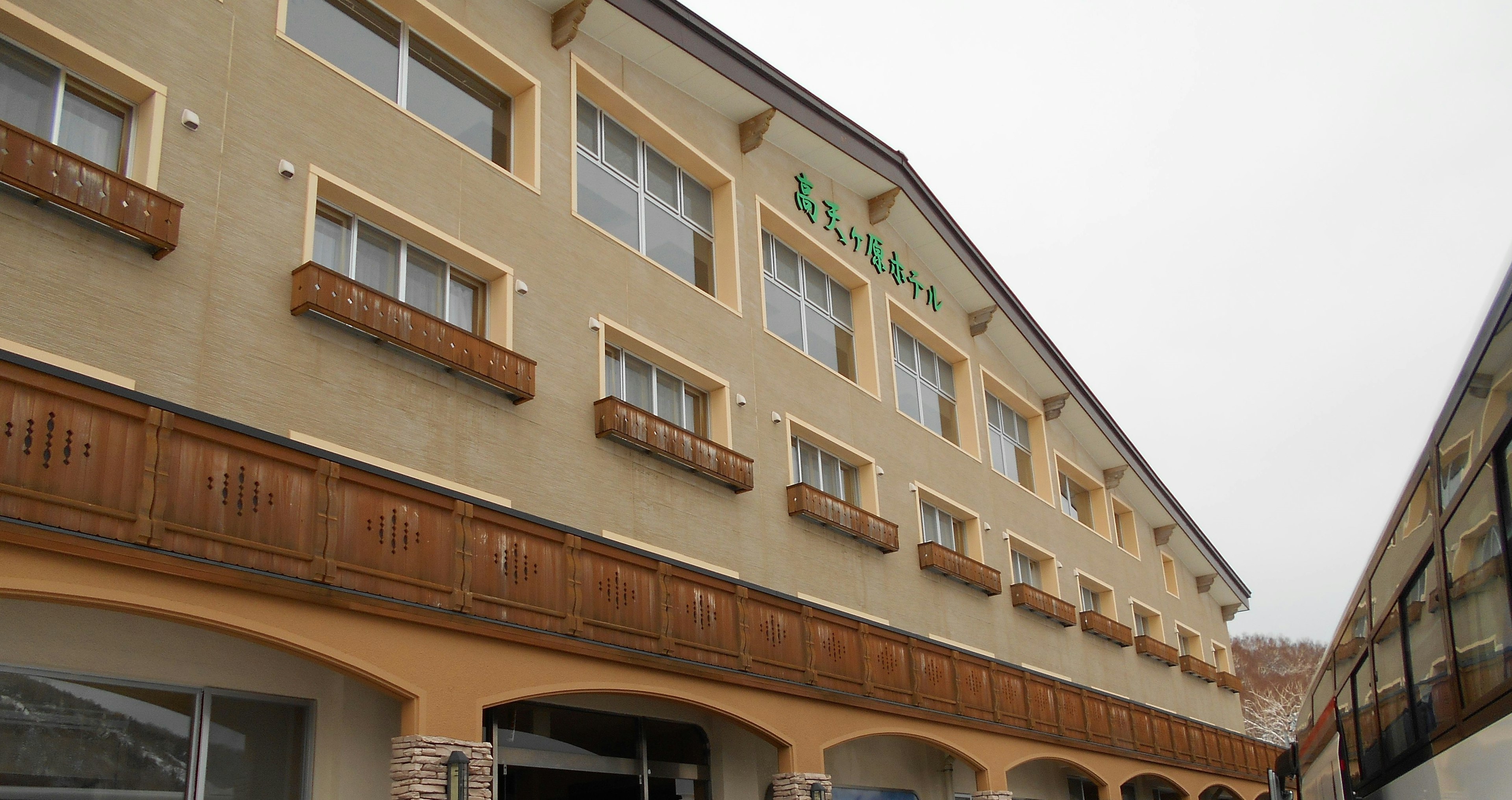 Exterior view of a mountain lodge style building with balconies