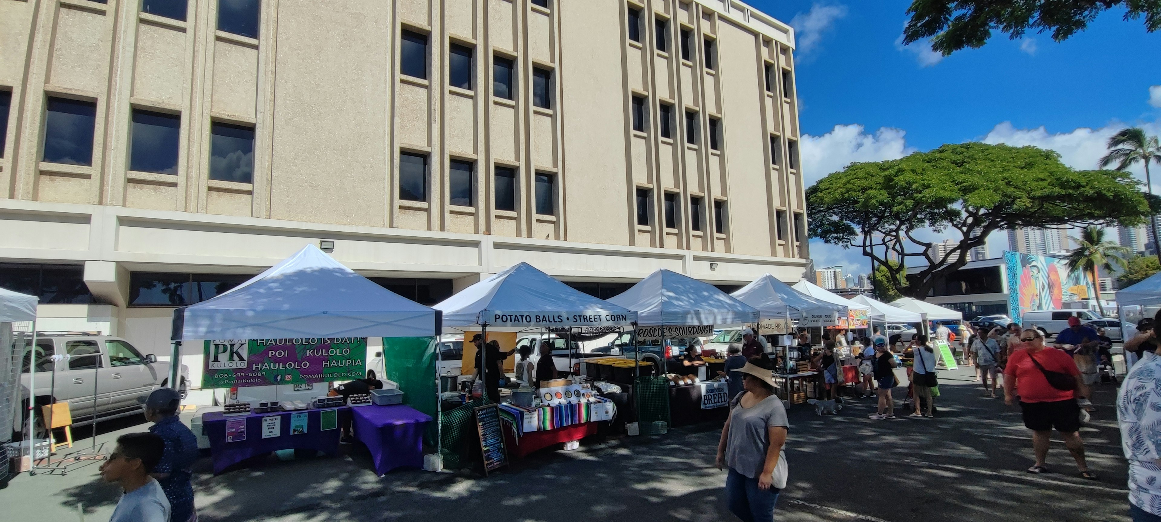 Market scene with tents under a clear blue sky