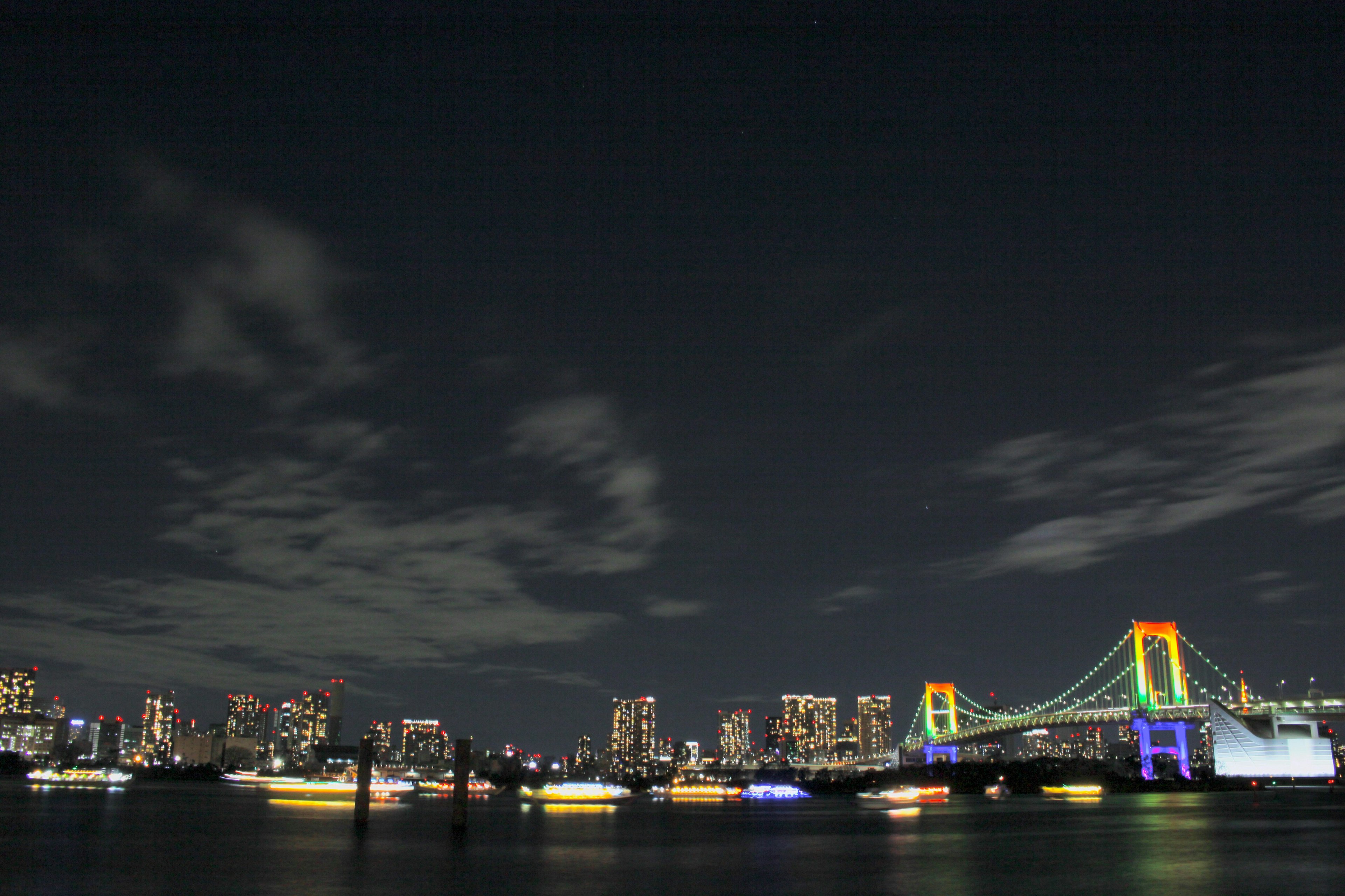 Rainbow Bridge and Tokyo skyline illuminated at night