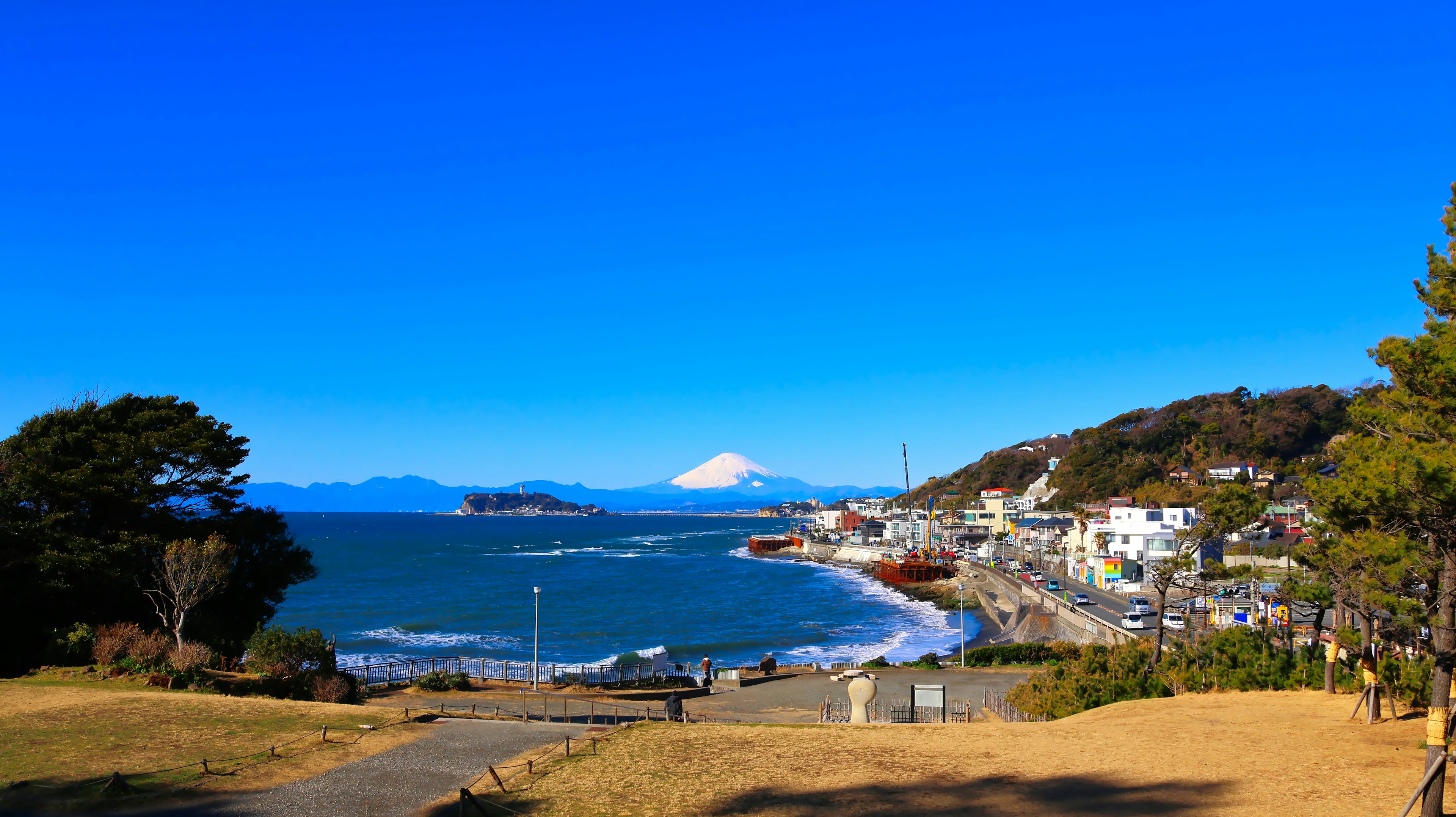 Scenic view of Mount Fuji with a clear blue sky and coastline