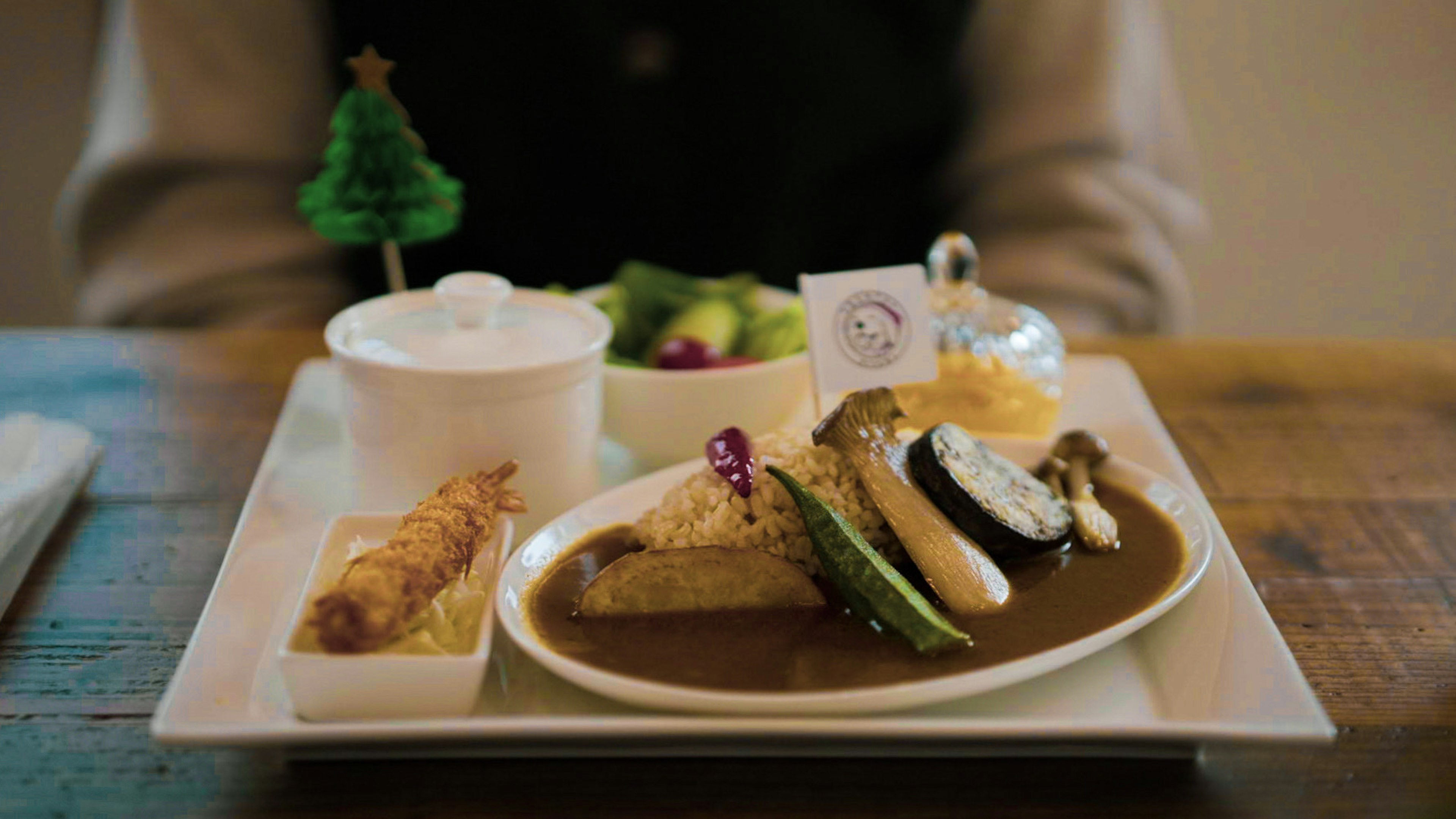 A beautifully plated meal on a table featuring various dishes