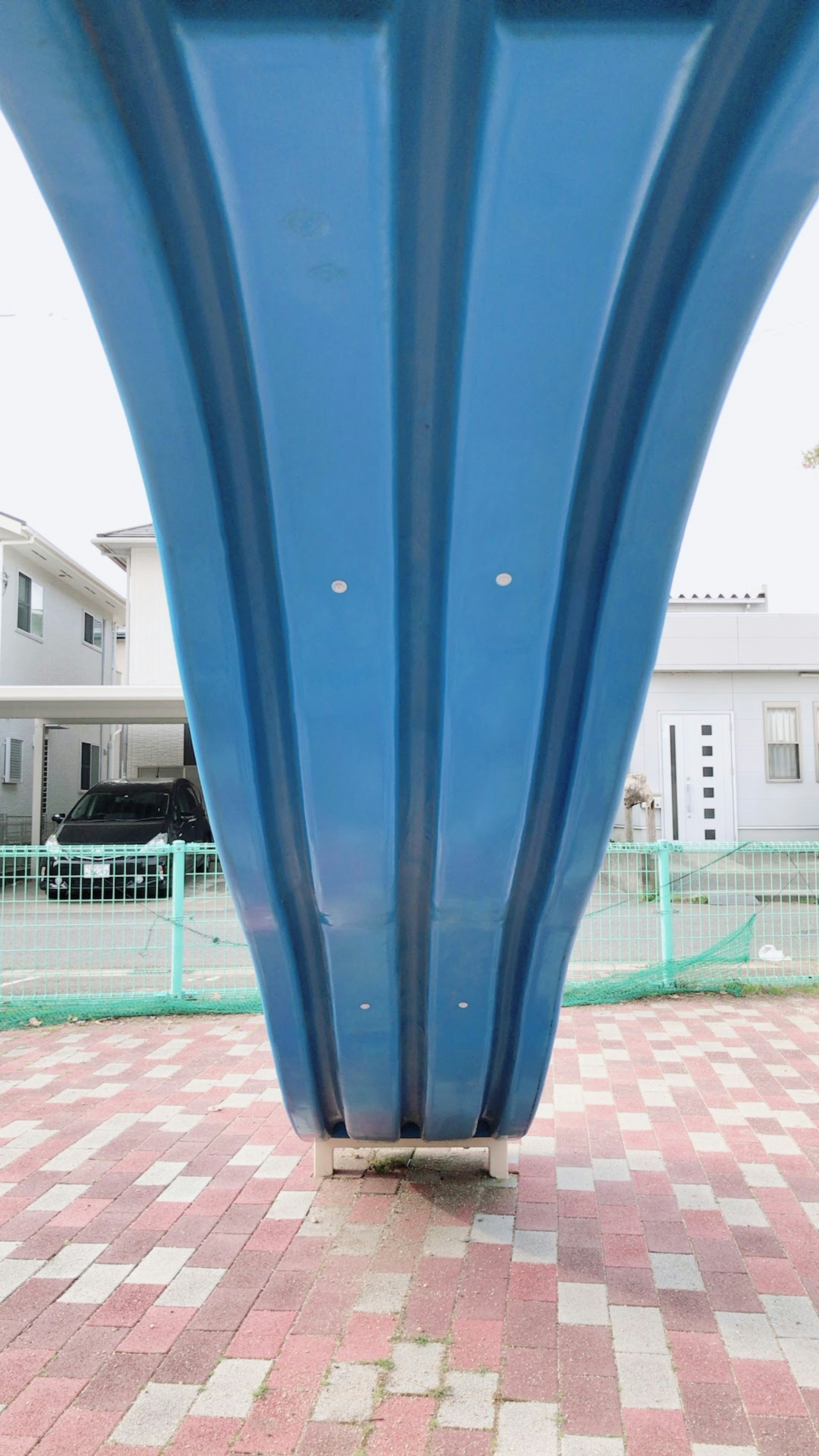 View from underneath a blue arch structure