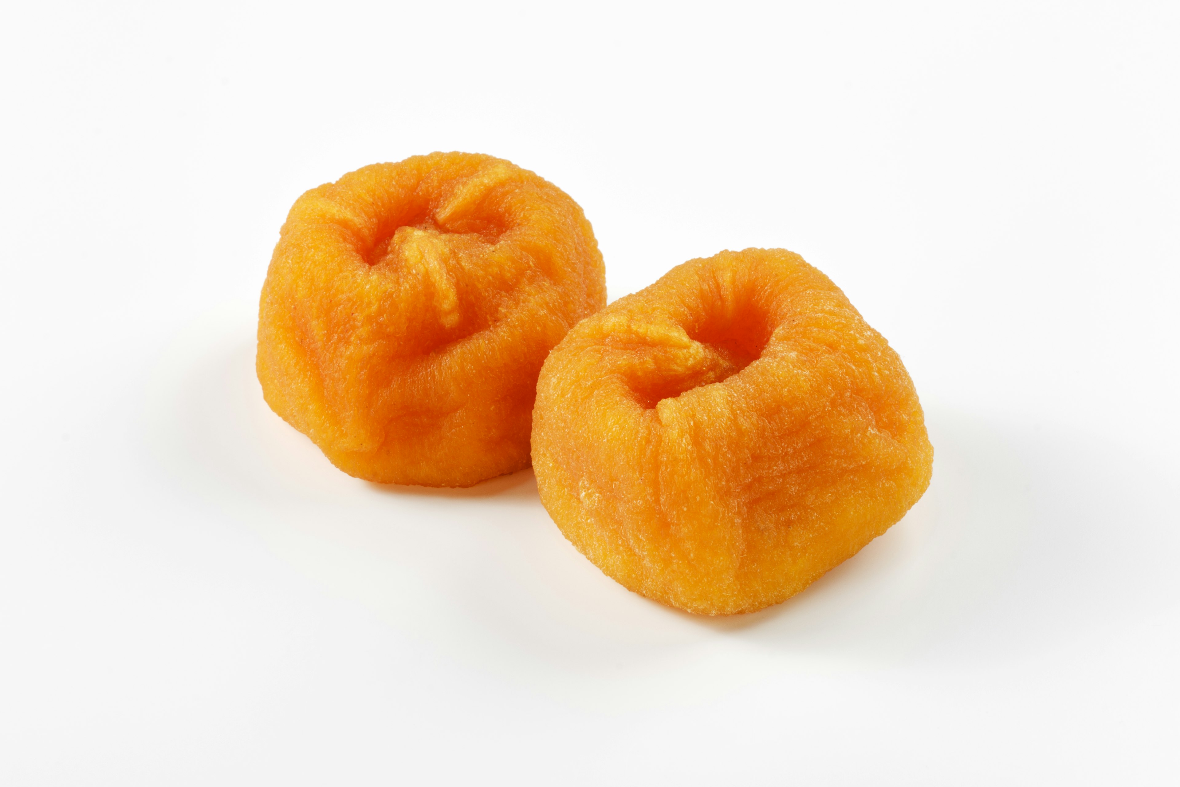 Two round orange sweets placed side by side