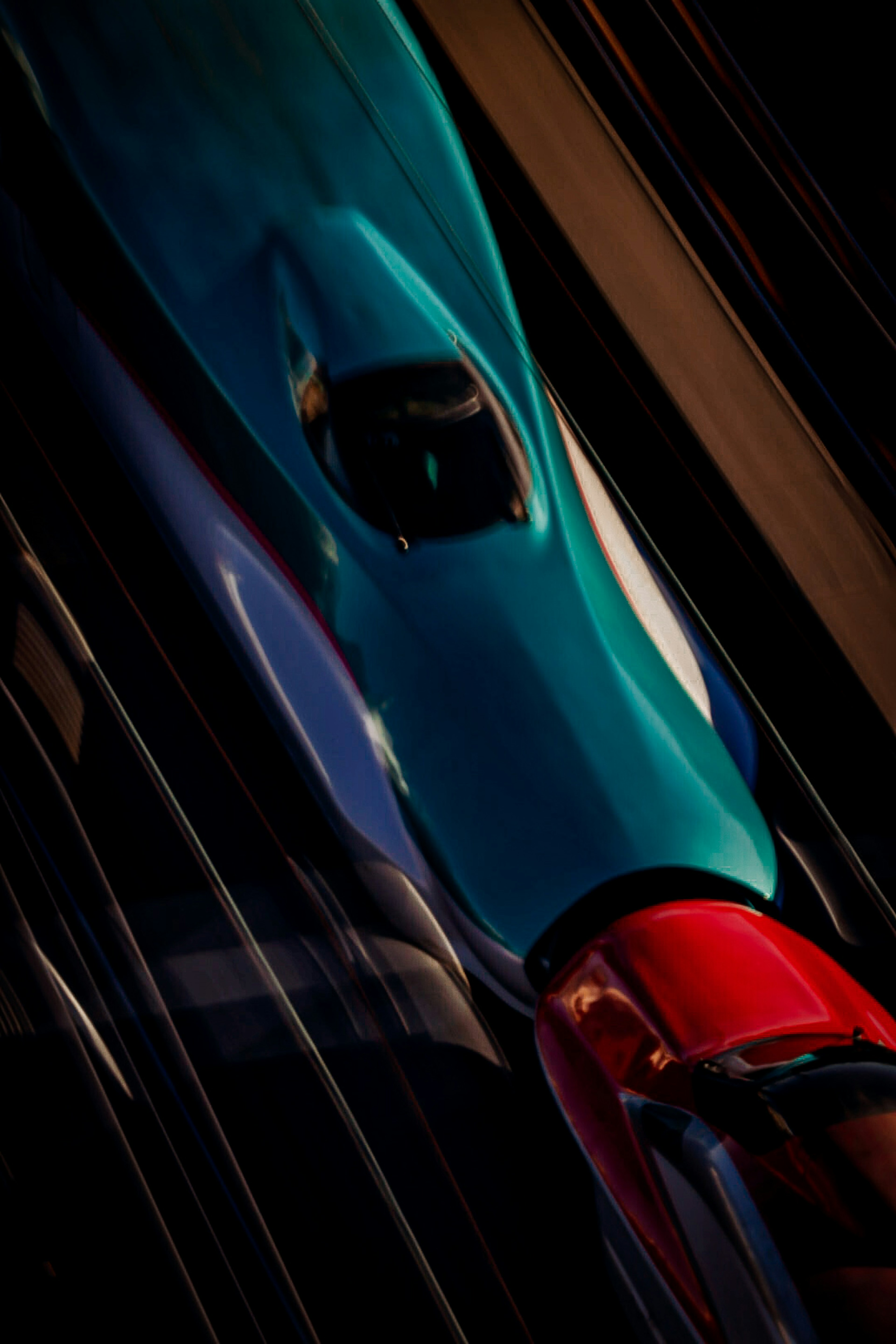 Top view of a colorful sports car in blue and red