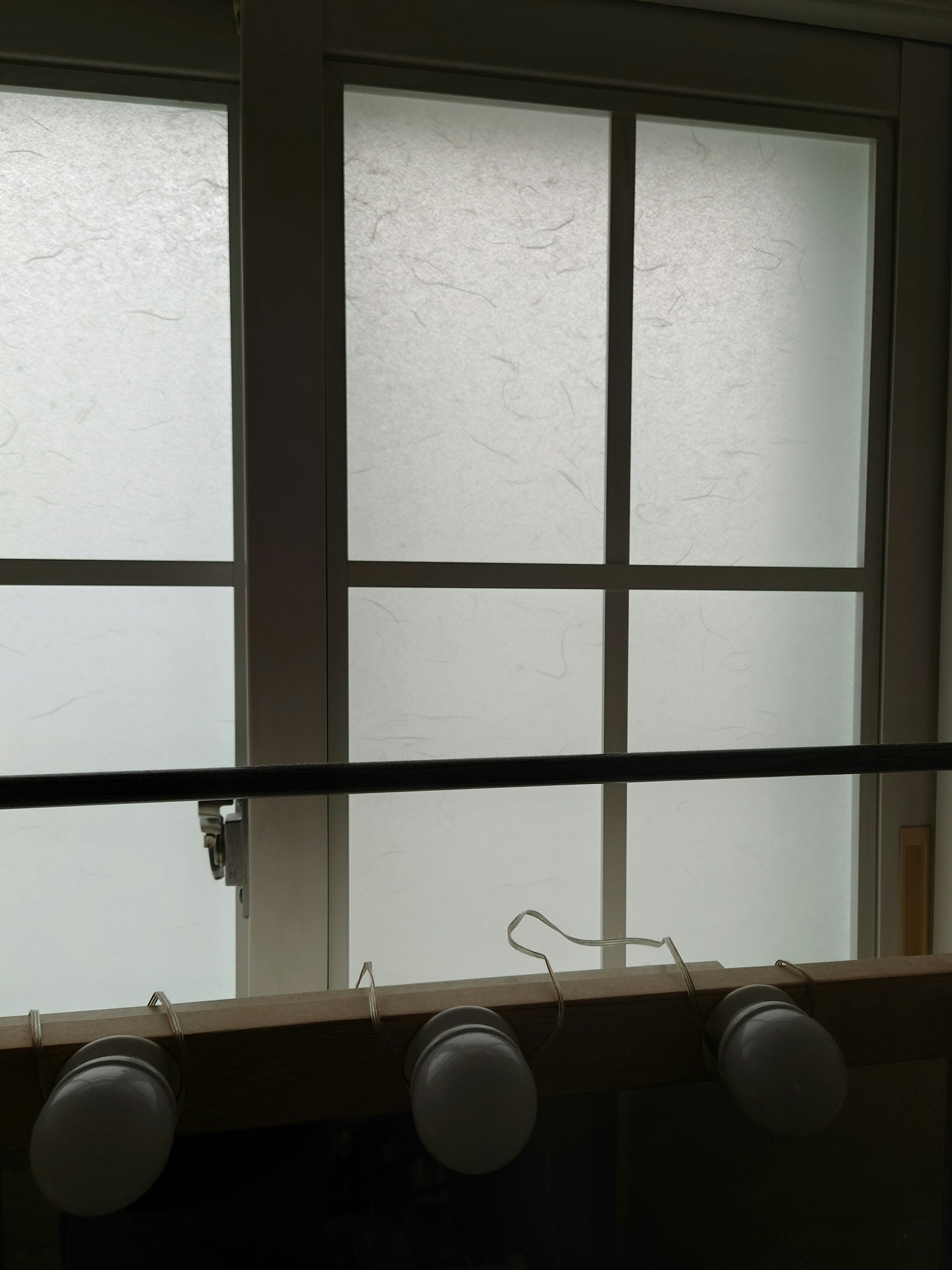 Indoor view featuring foggy windows and white walls