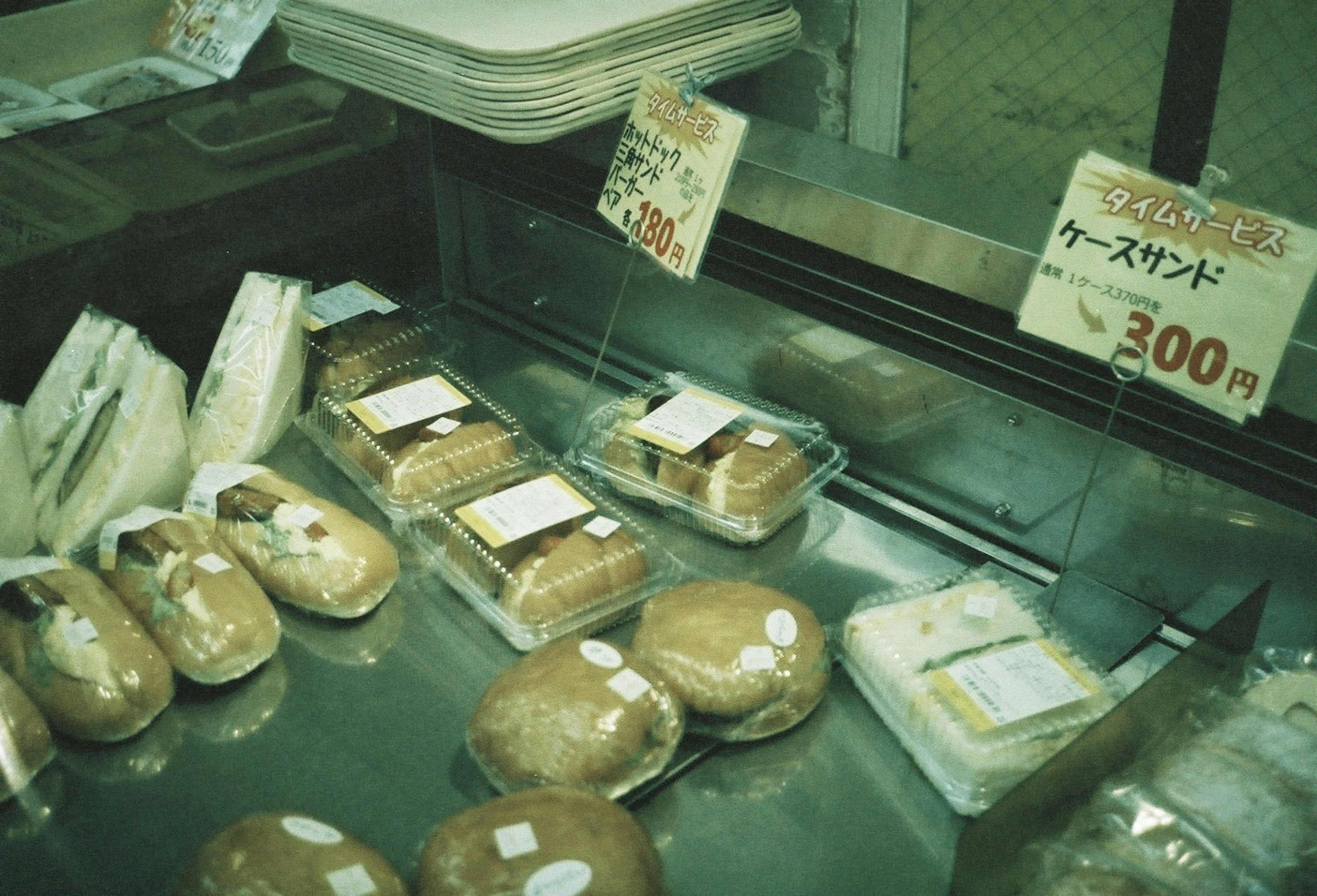 Display of various types of bread and sandwiches in a store