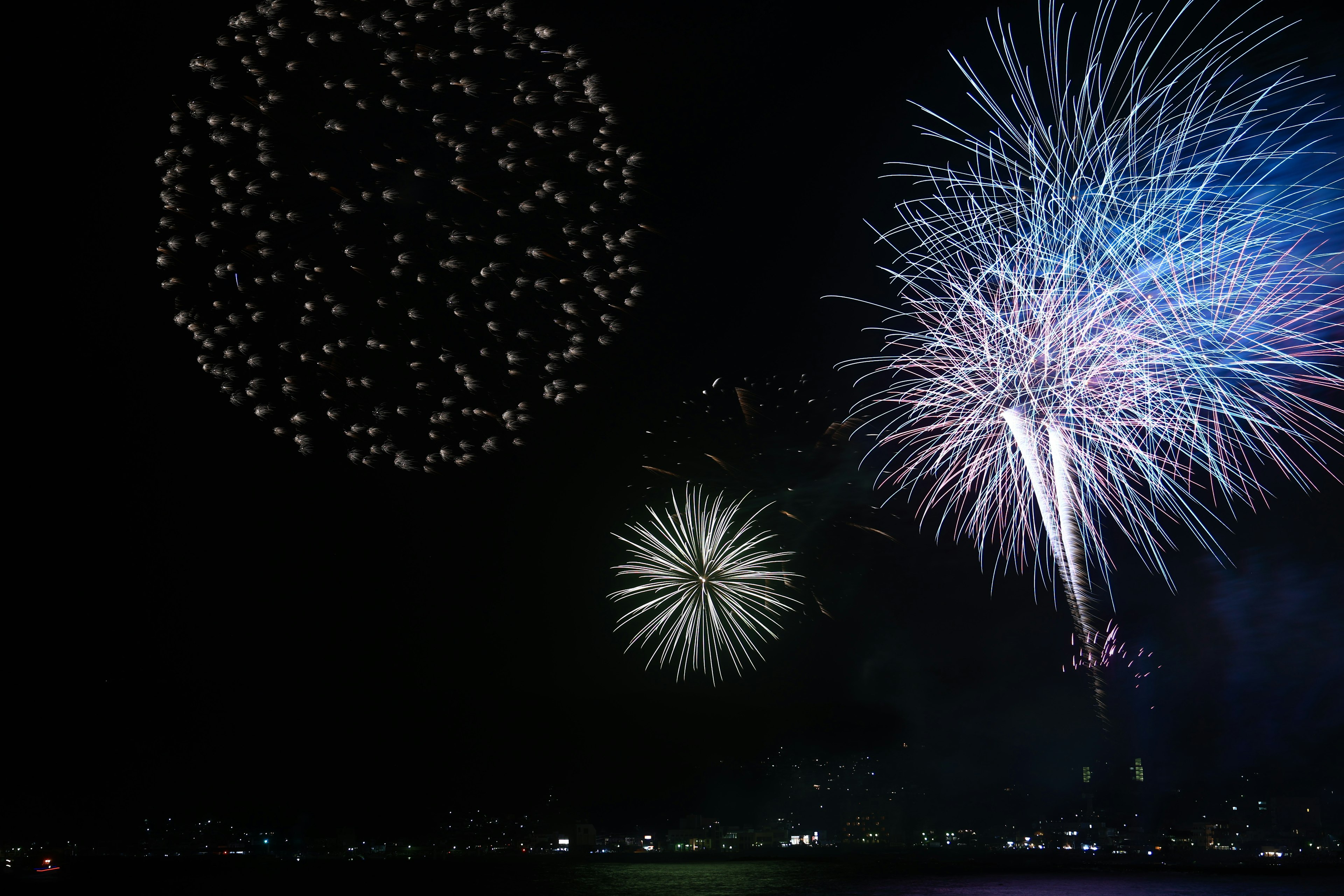 Colorful fireworks exploding in the night sky