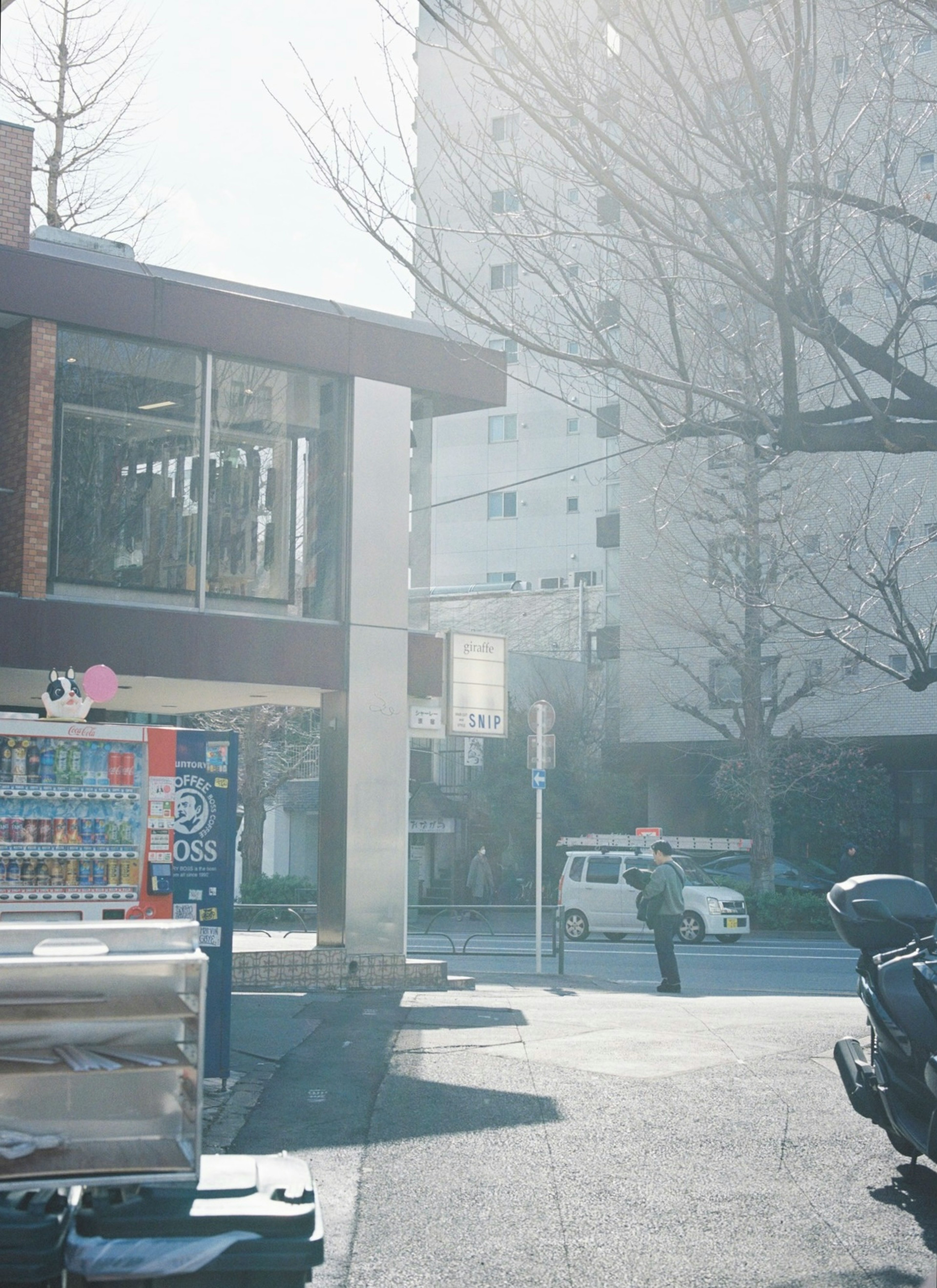 Urban scene with bright sunlight and people