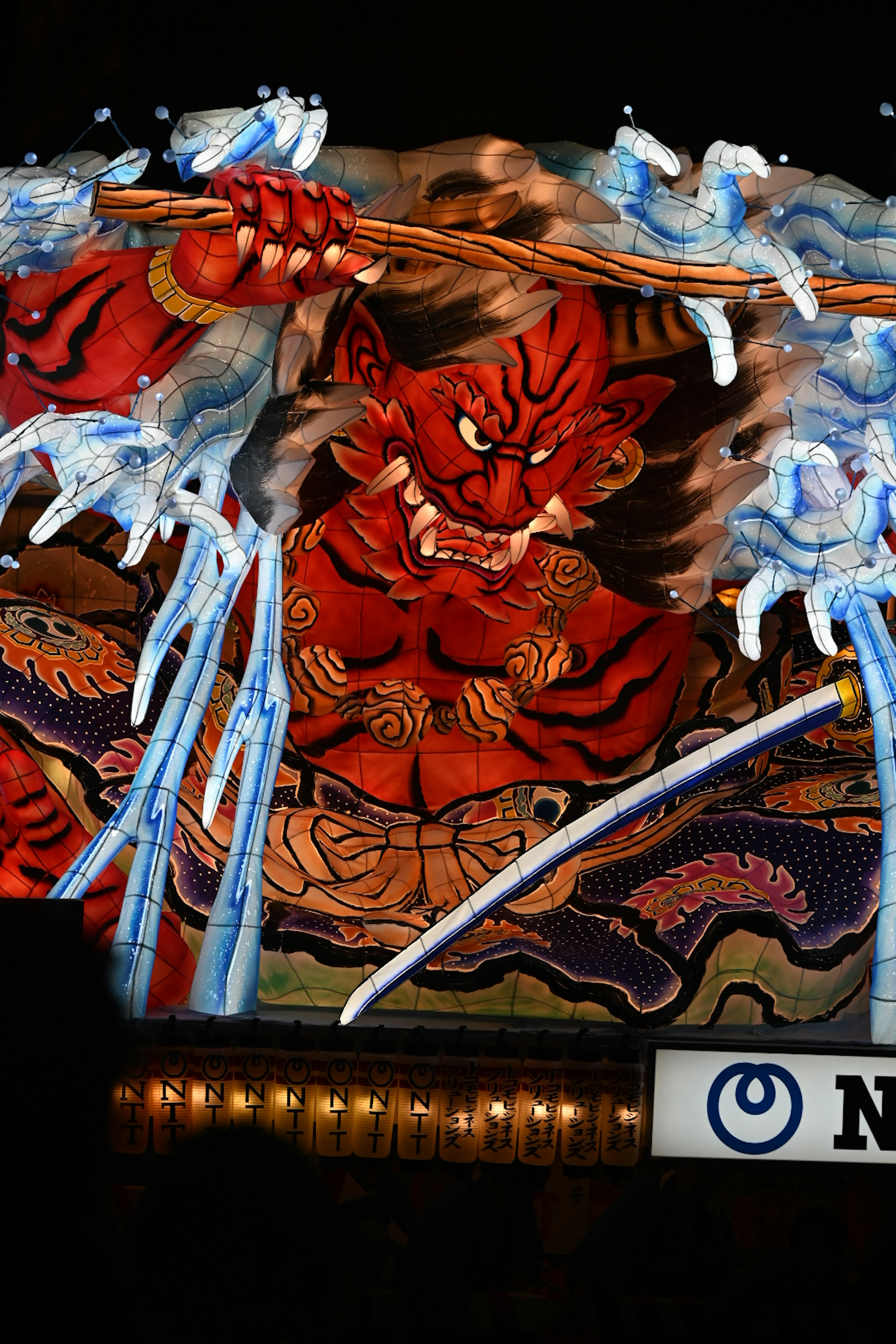 Red demon battling water spirits in ukiyo-e style art