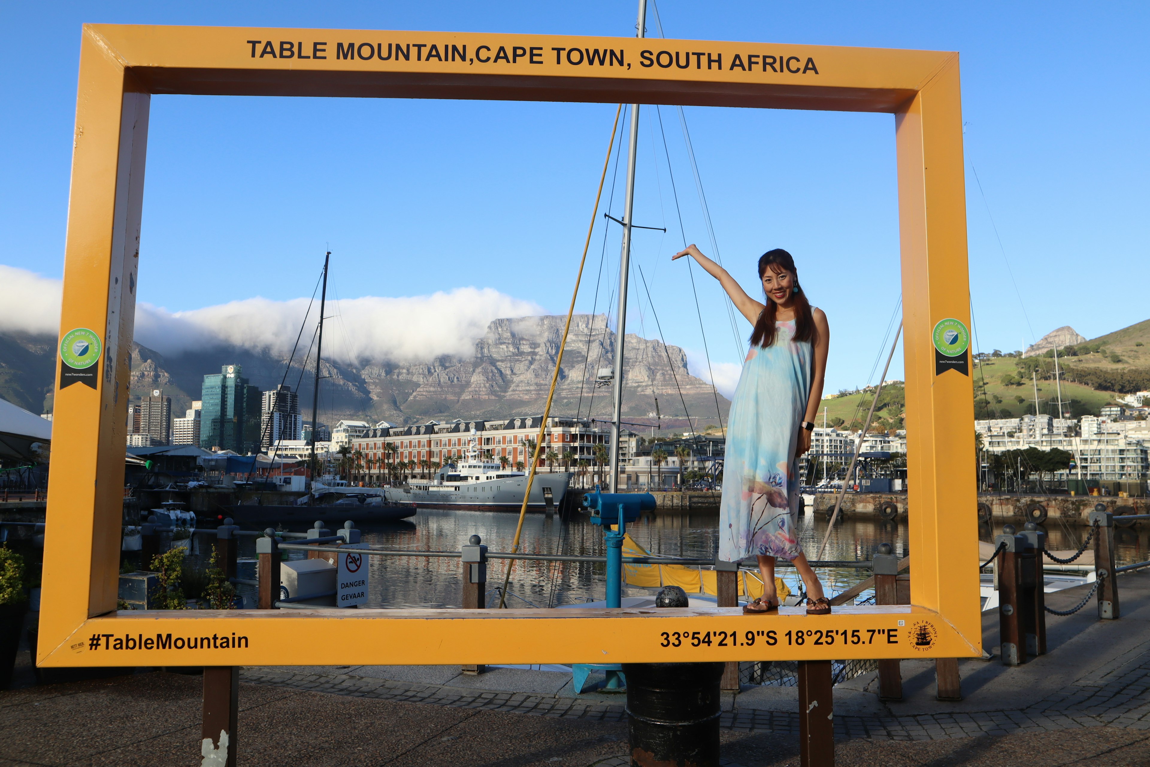 Woman standing in a frame with Table Mountain in Cape Town South Africa