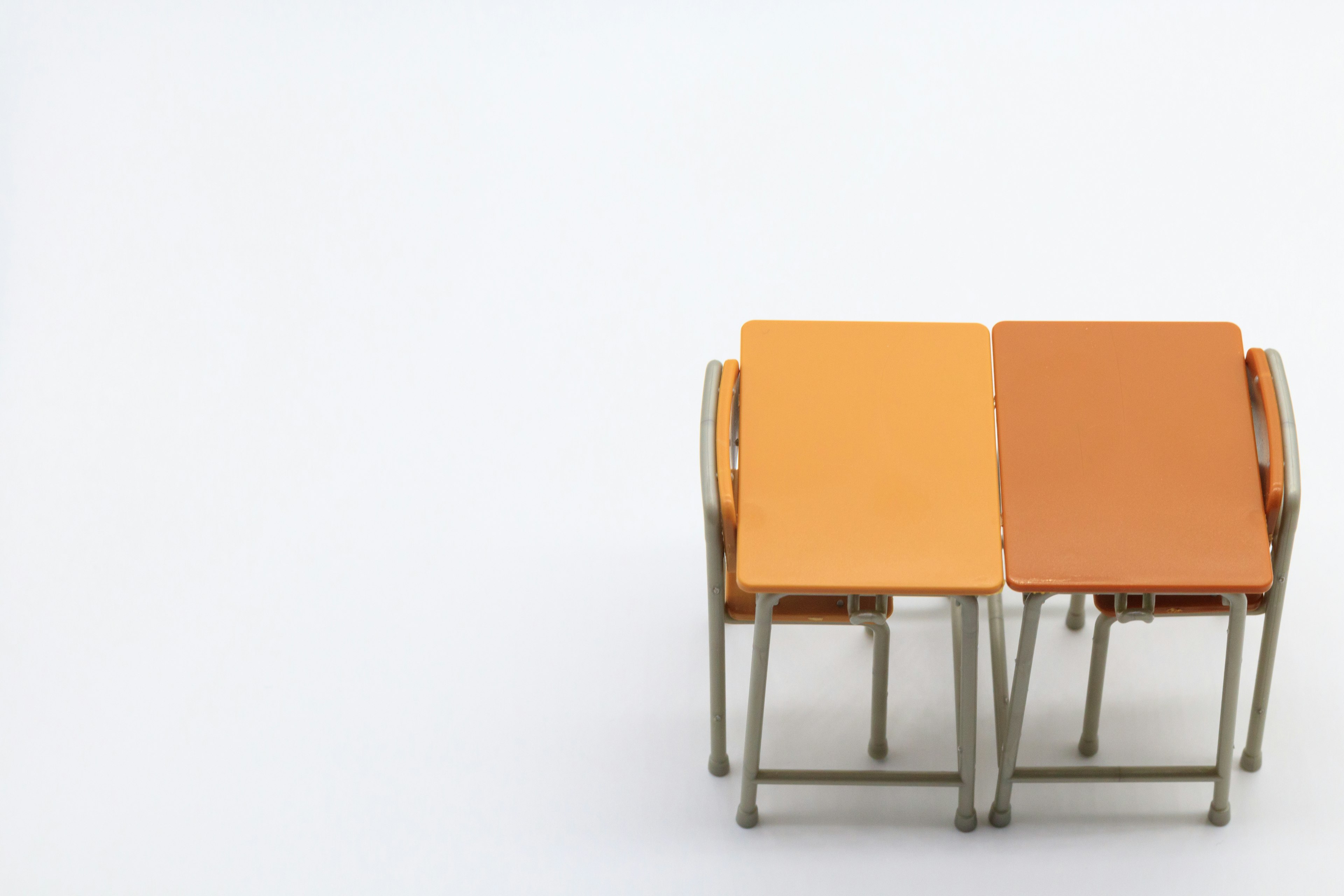 Two tables arranged side by side with contrasting colors