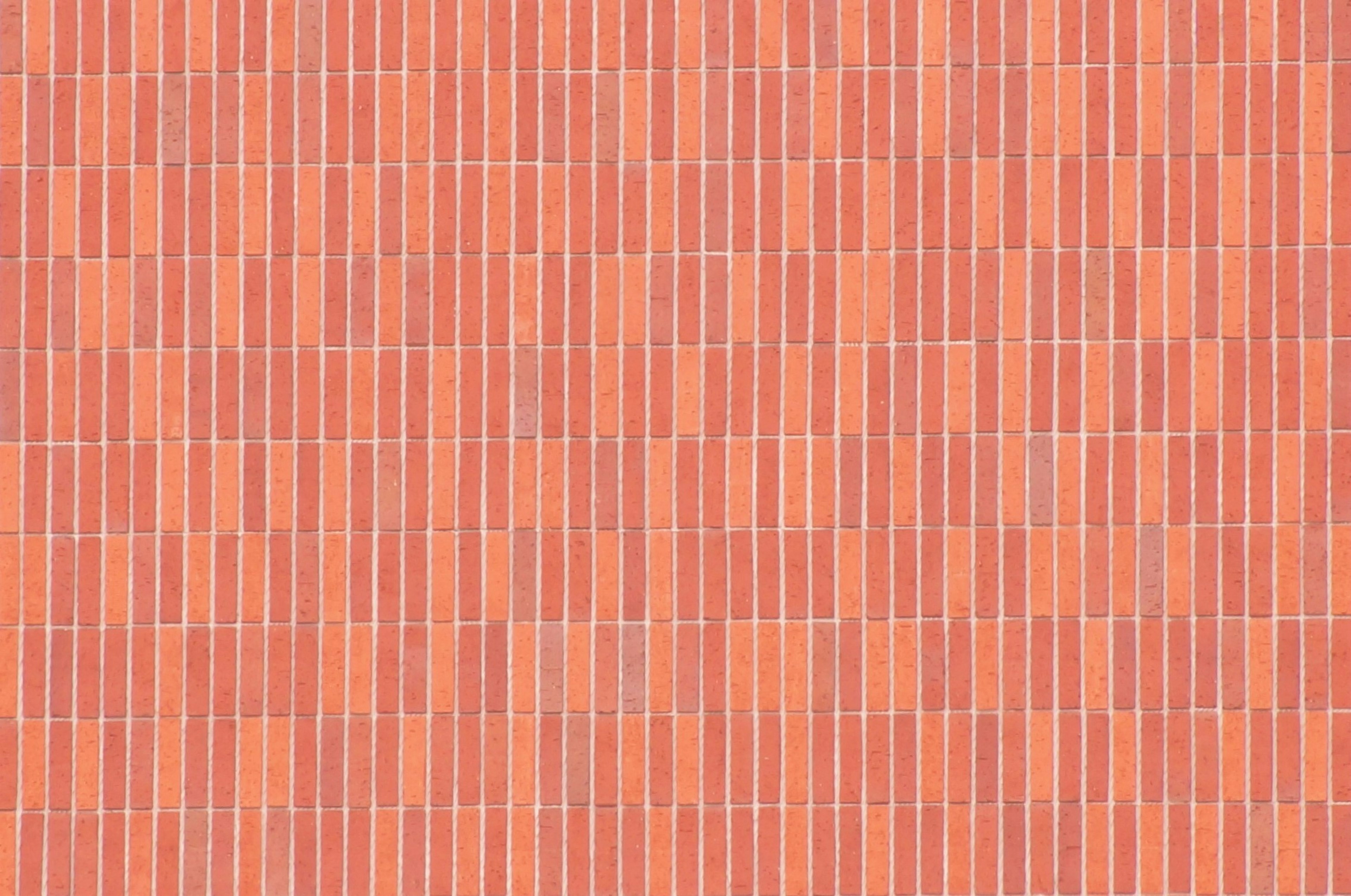 Pattern of a red brick wall with a uniform texture